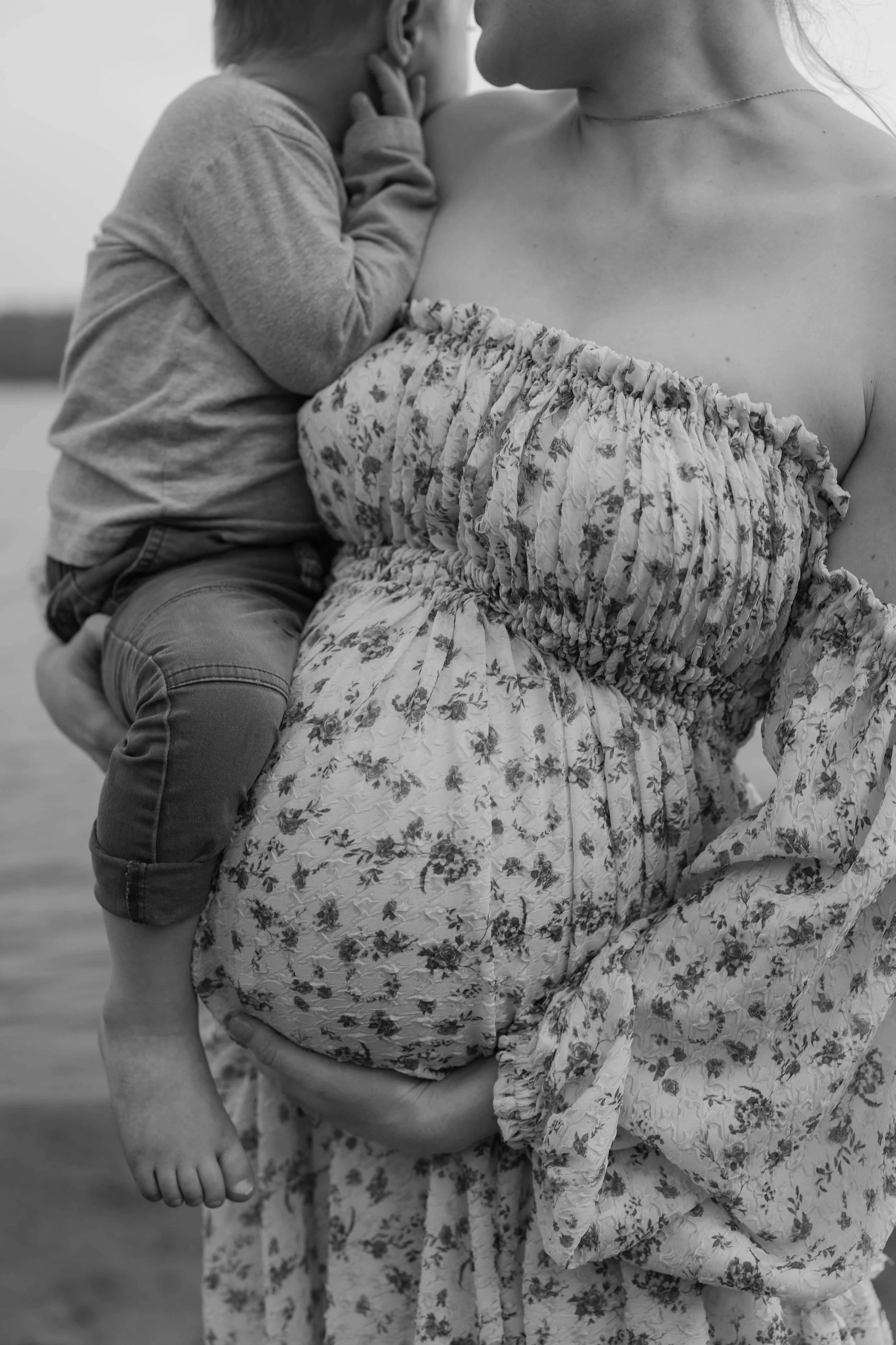 Mother and child doing maternity photos at Lake Alvin near Sioux Falls, South Dakota. Photographed by Jenna Heckel Photography.