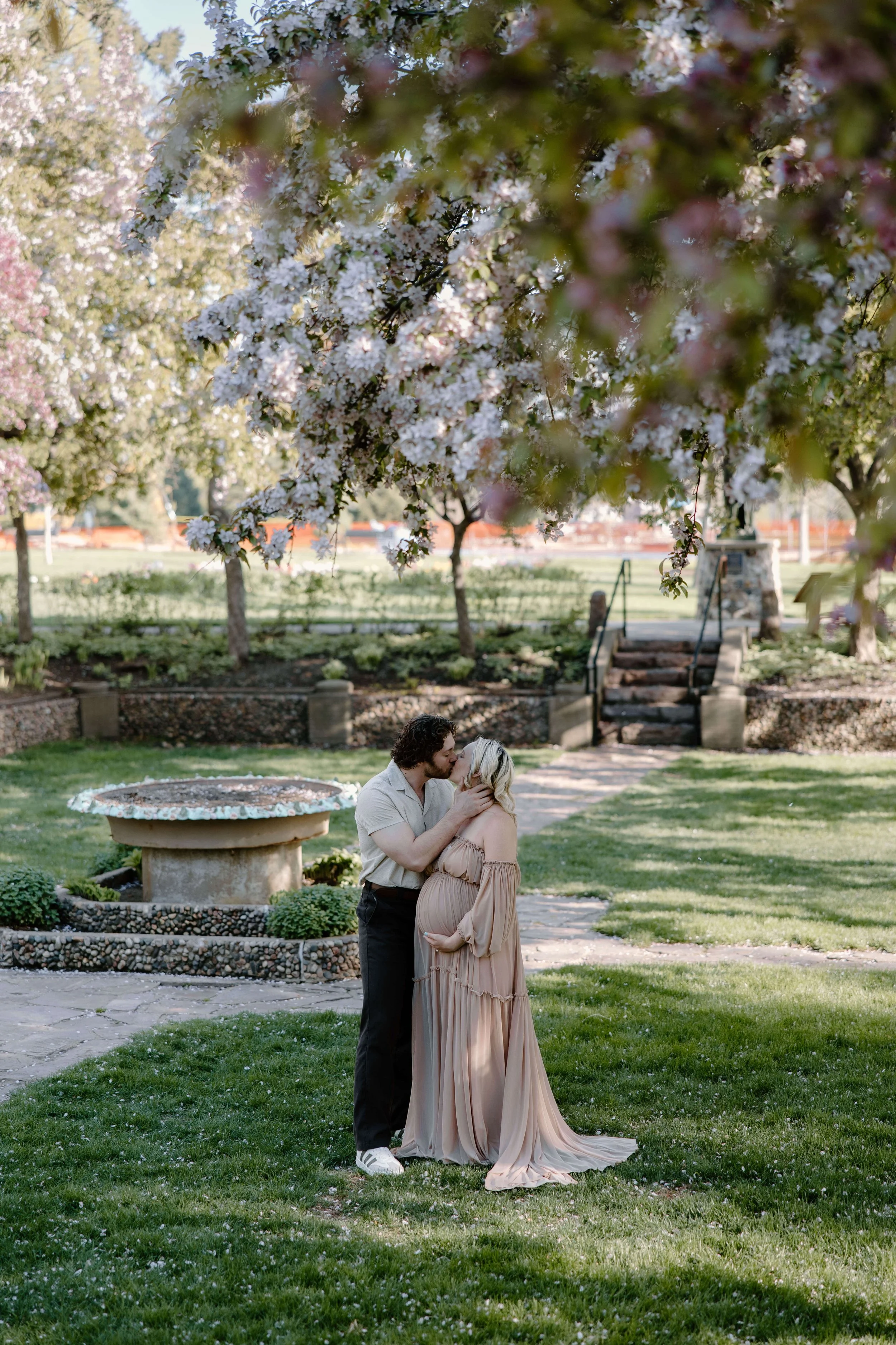 Couple doing maternity photos at McKennan park in central Sioux Falls, South Dakota. Photographed by Jenna Heckel Photography.