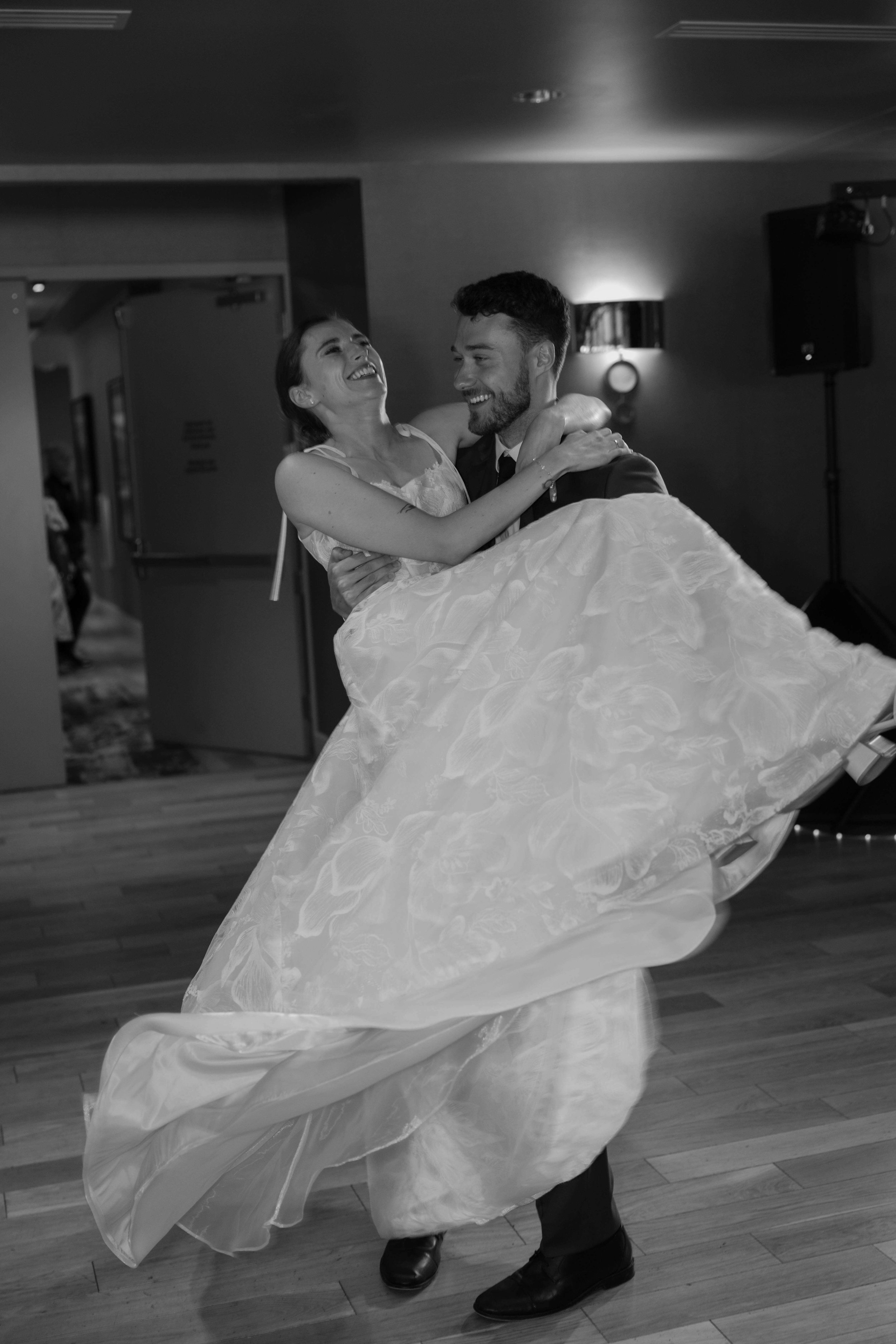 Bride and groom doing first dance and the Minnehaha country club in Sioux Falls, SD. Photographed by Jenna Heckel.