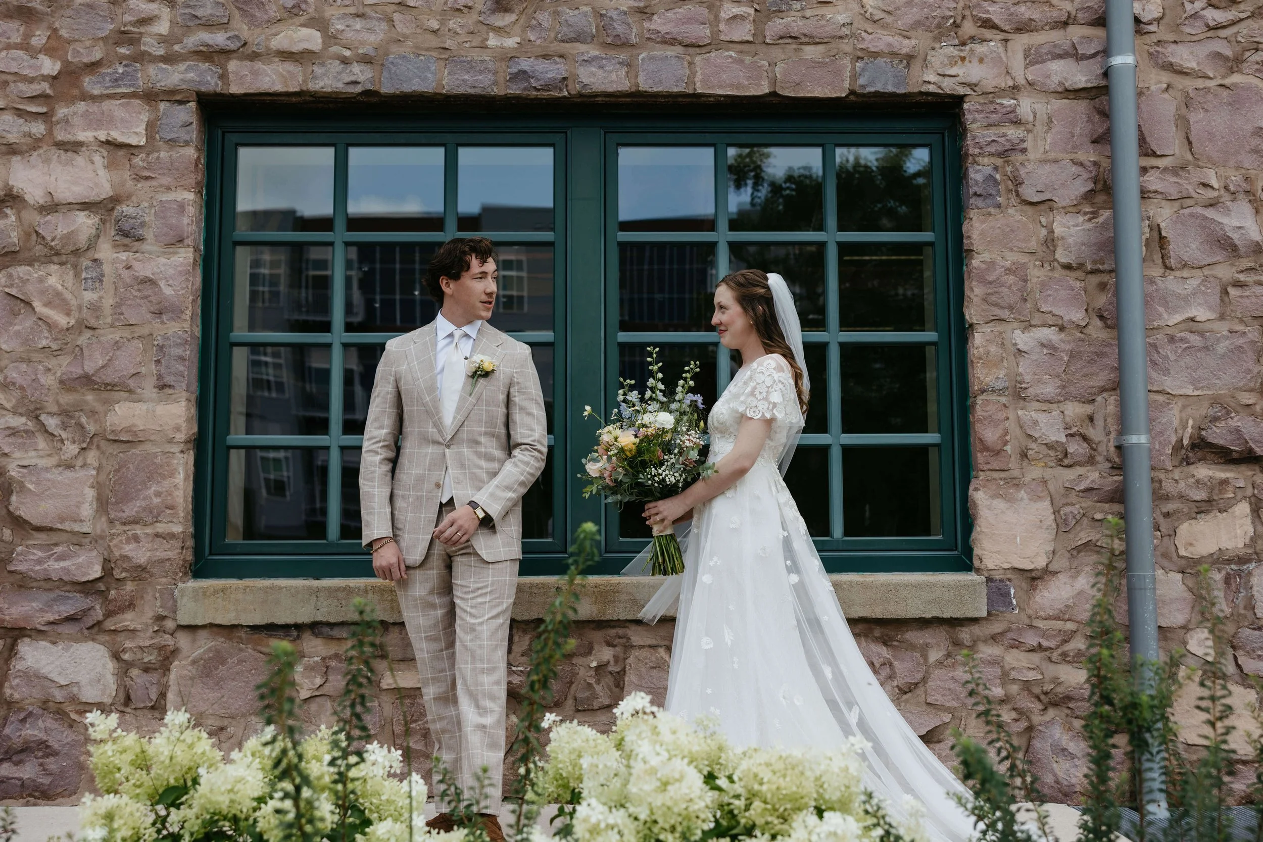 Couple doing first look at Mosaic wedding venue in downtown Sioux Falls photographed by Jenna Heckel Photography. 
