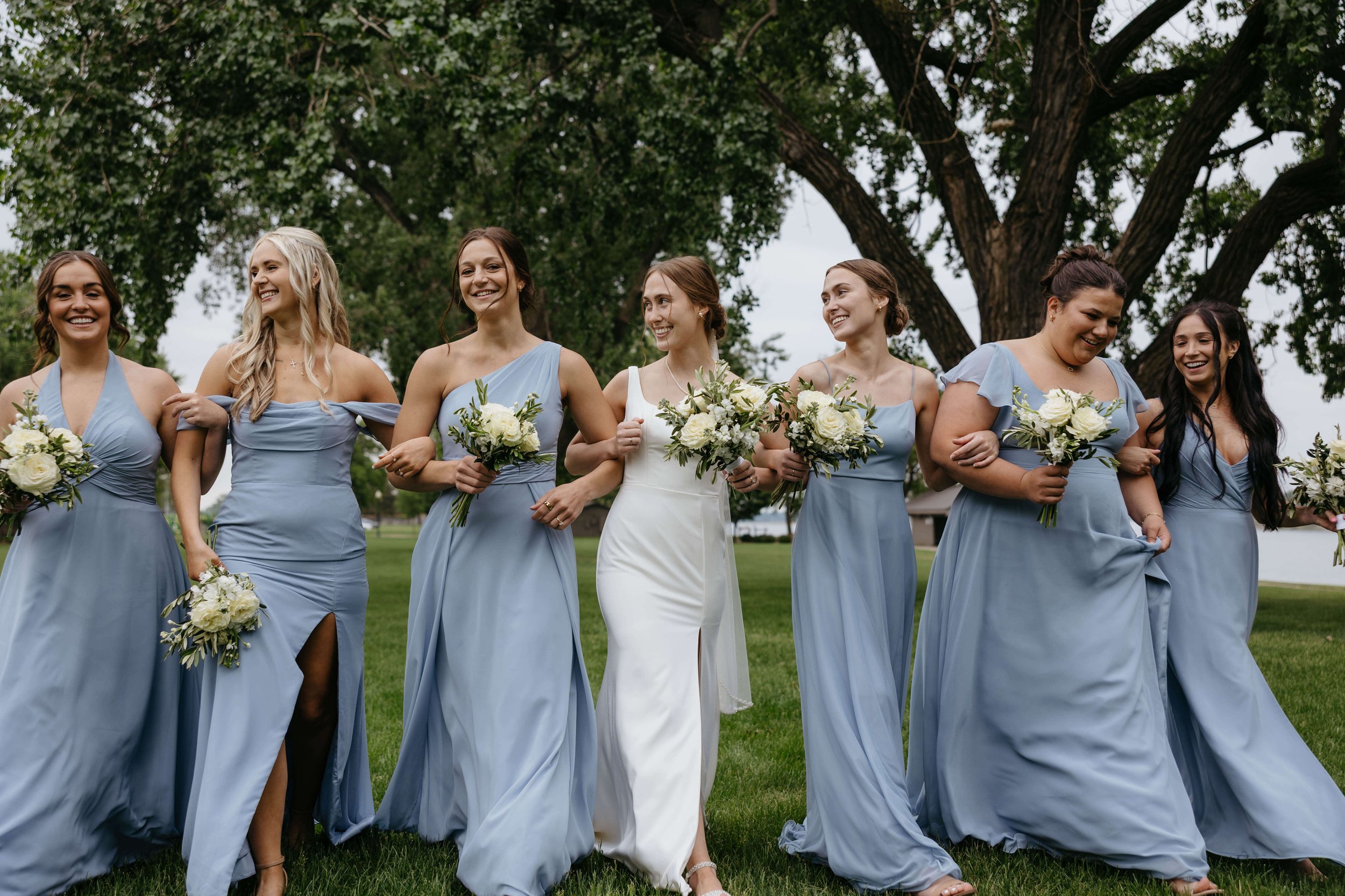 Fun wedding party photos by the river in Yankton South Dakota.