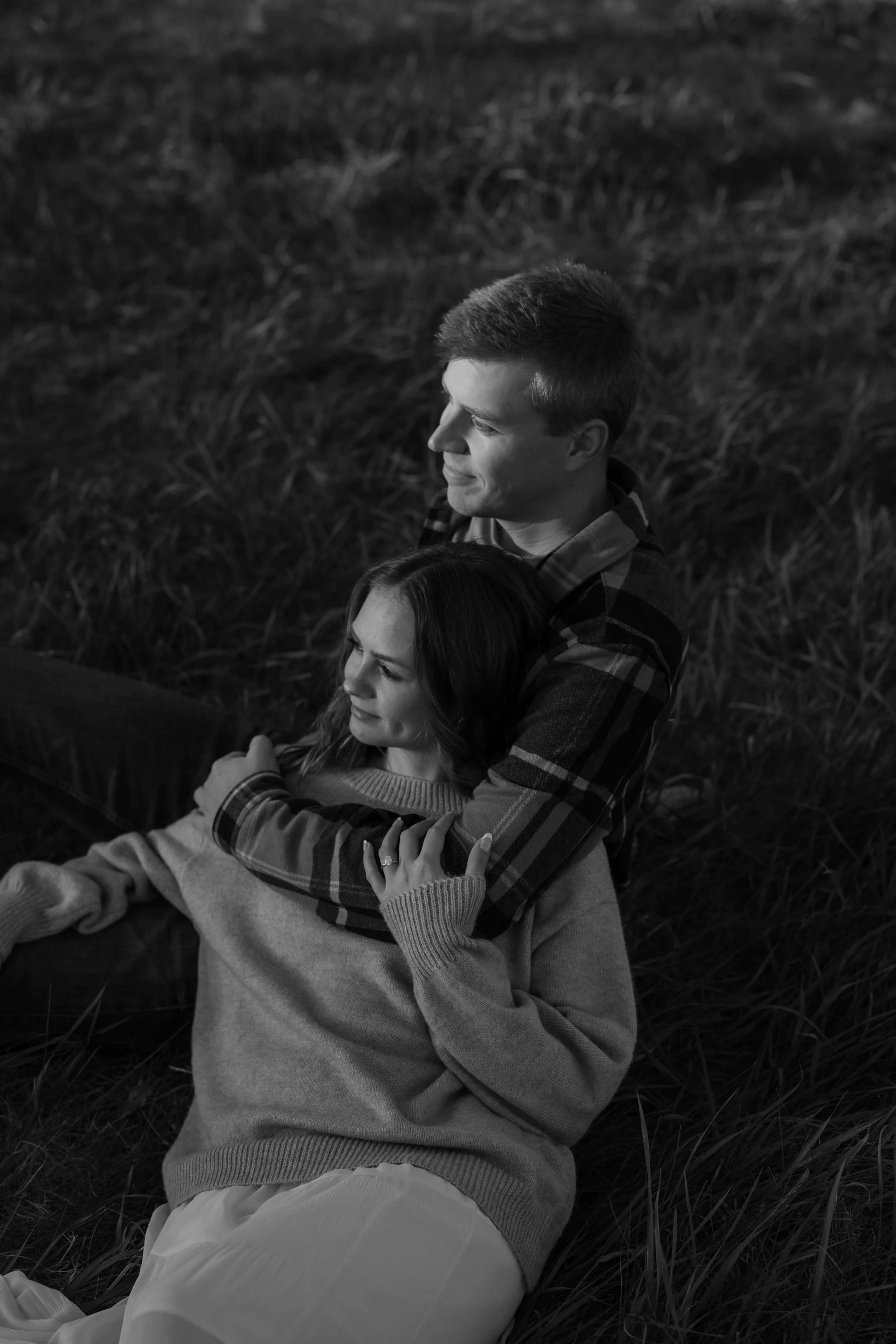 Moody black and white photo of couple during their engagement photos with Jenna Heckel Photography.