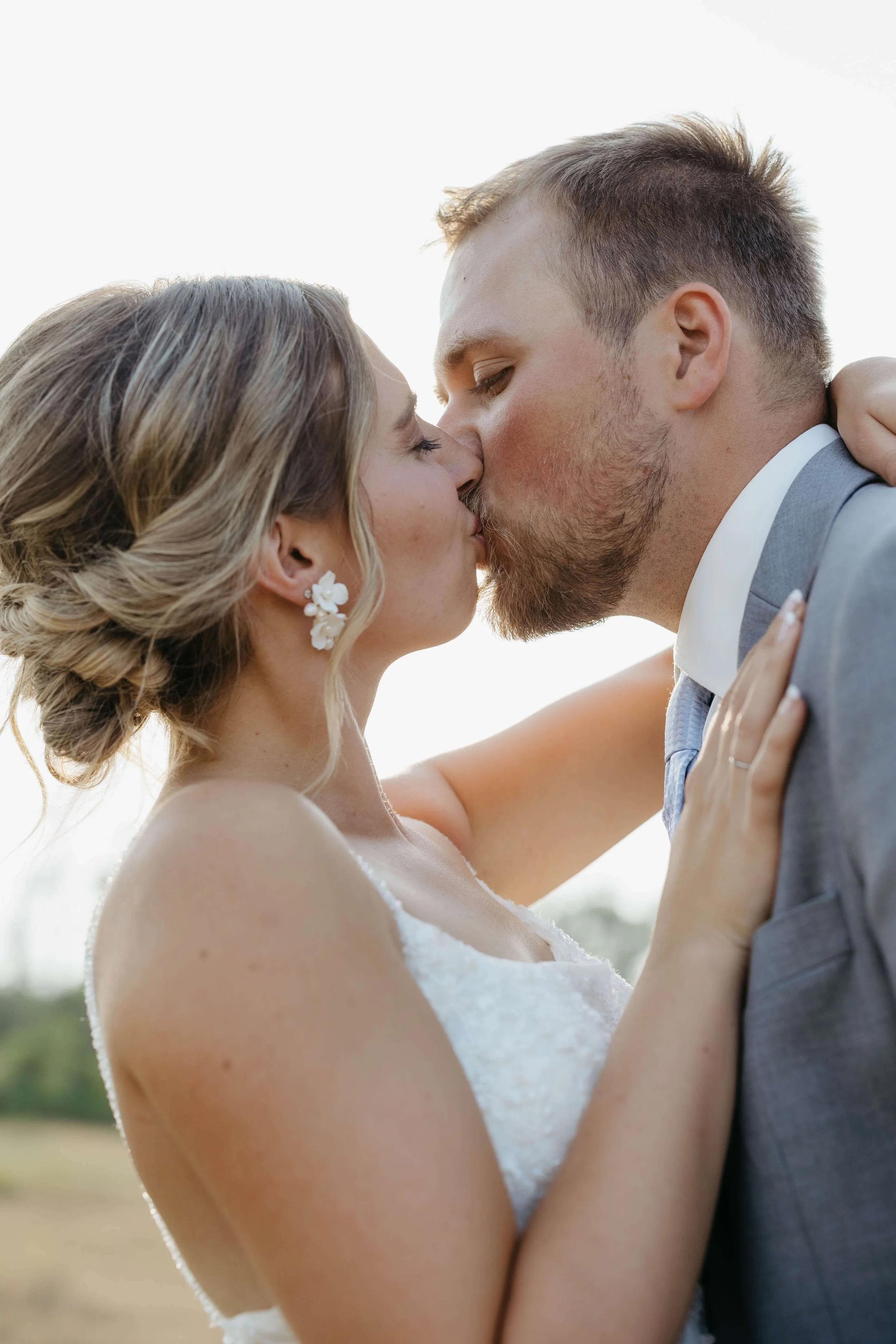 Couple taking sunset portraits in Mitchell South Dakota on their wedding day photographed by Jenna Heckel Photography.