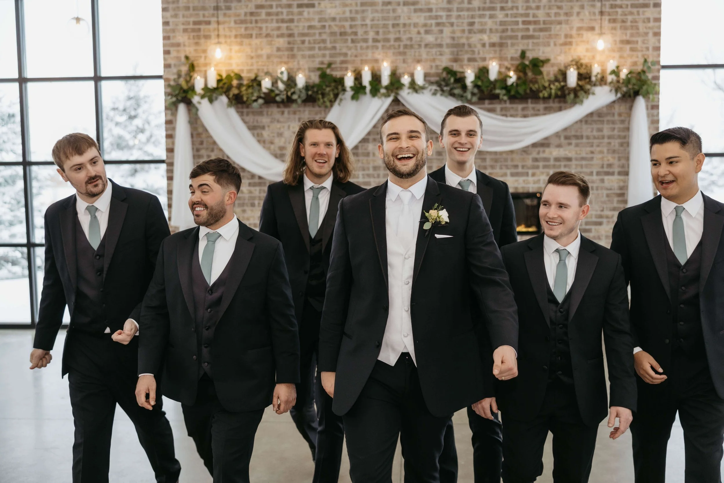 Couple doing wedding party photos at The Atrium in Sioux Falls, South Dakota. Photographed by Jenna Heckel Photography.