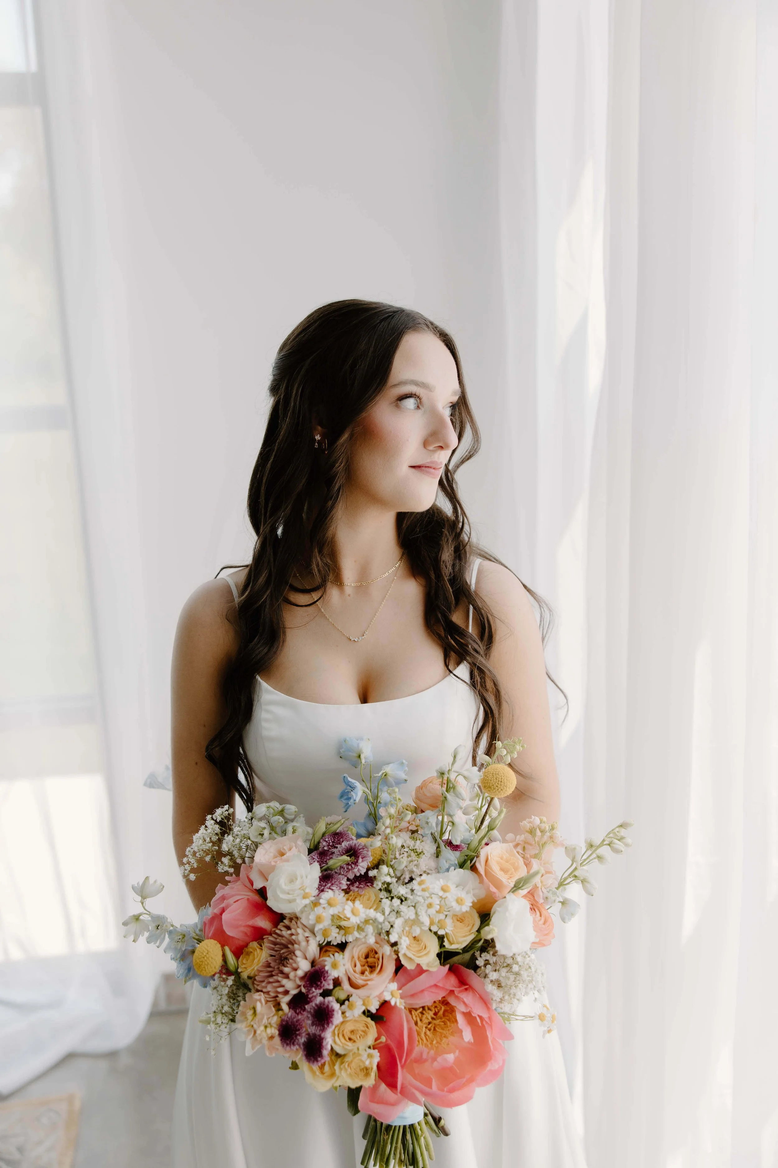 Bridal portraits of bride at summer wedding on her wedding day at The Atrium in Sioux Falls, photographed by Jenna Heckel Photography.