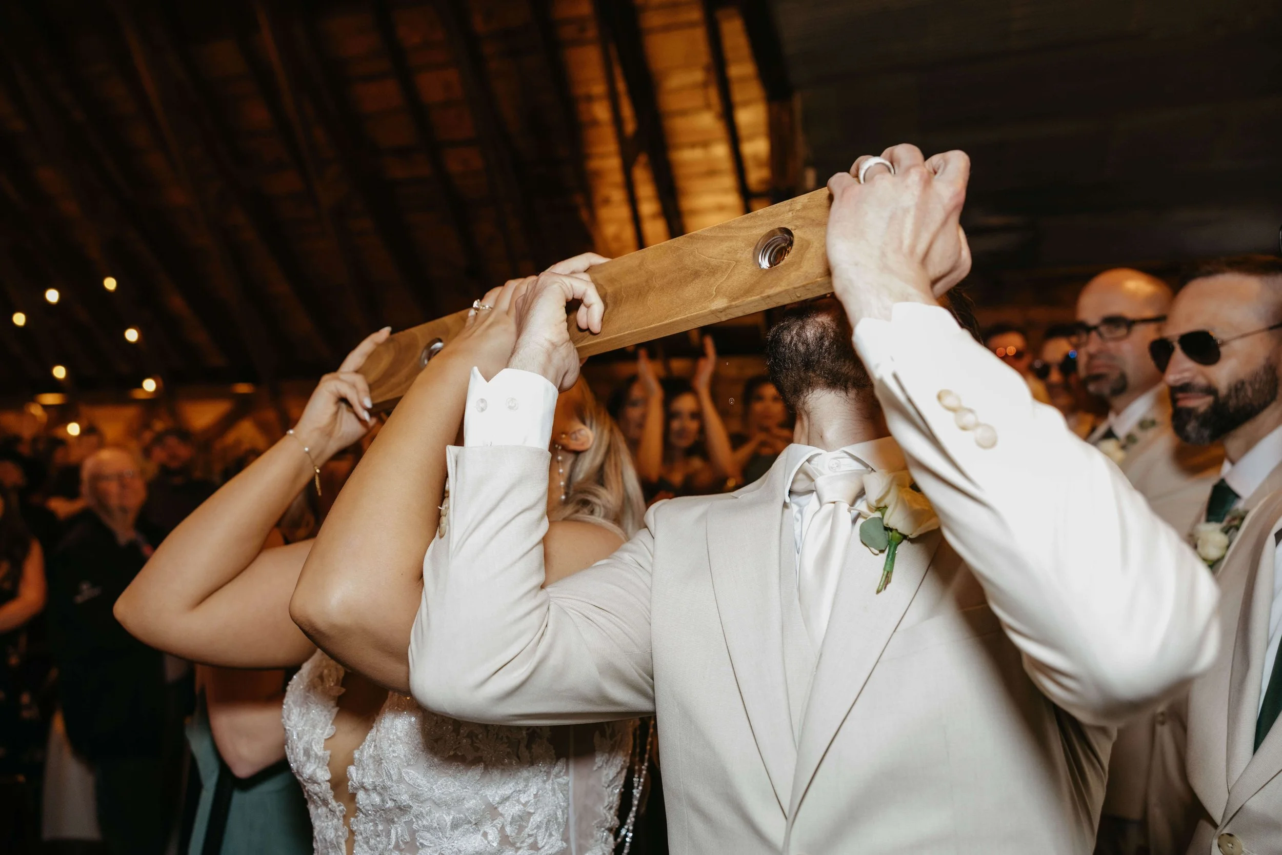 Bride and groom doing shots during their wedding reception at the Canton Barn in Canton, South Dakota.