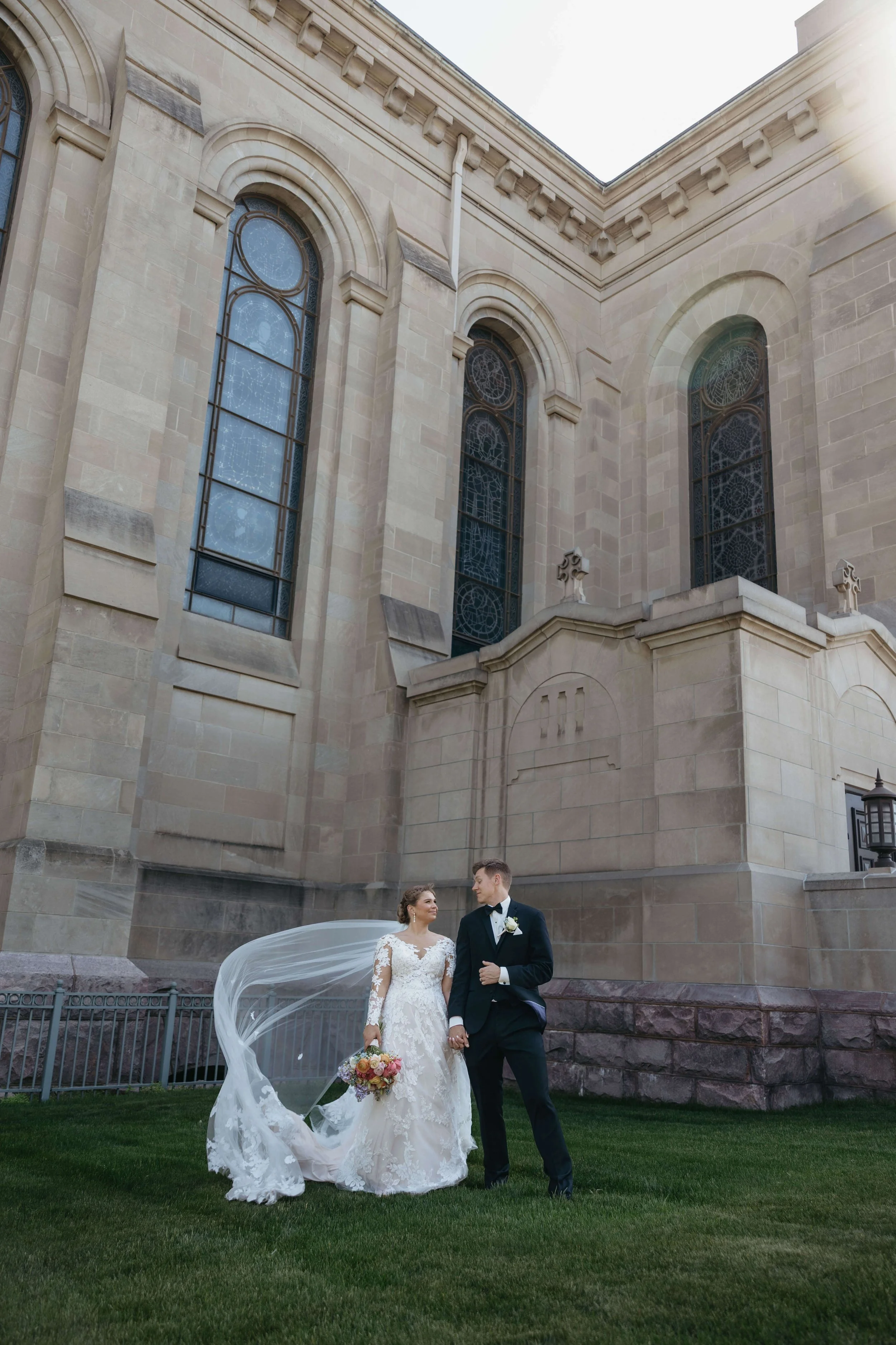 Bride and groom during their Catholic ceremony at St Joesphs Cathedral in downtown Sioux Falls. Photographed by Jenna Heckel Photography.