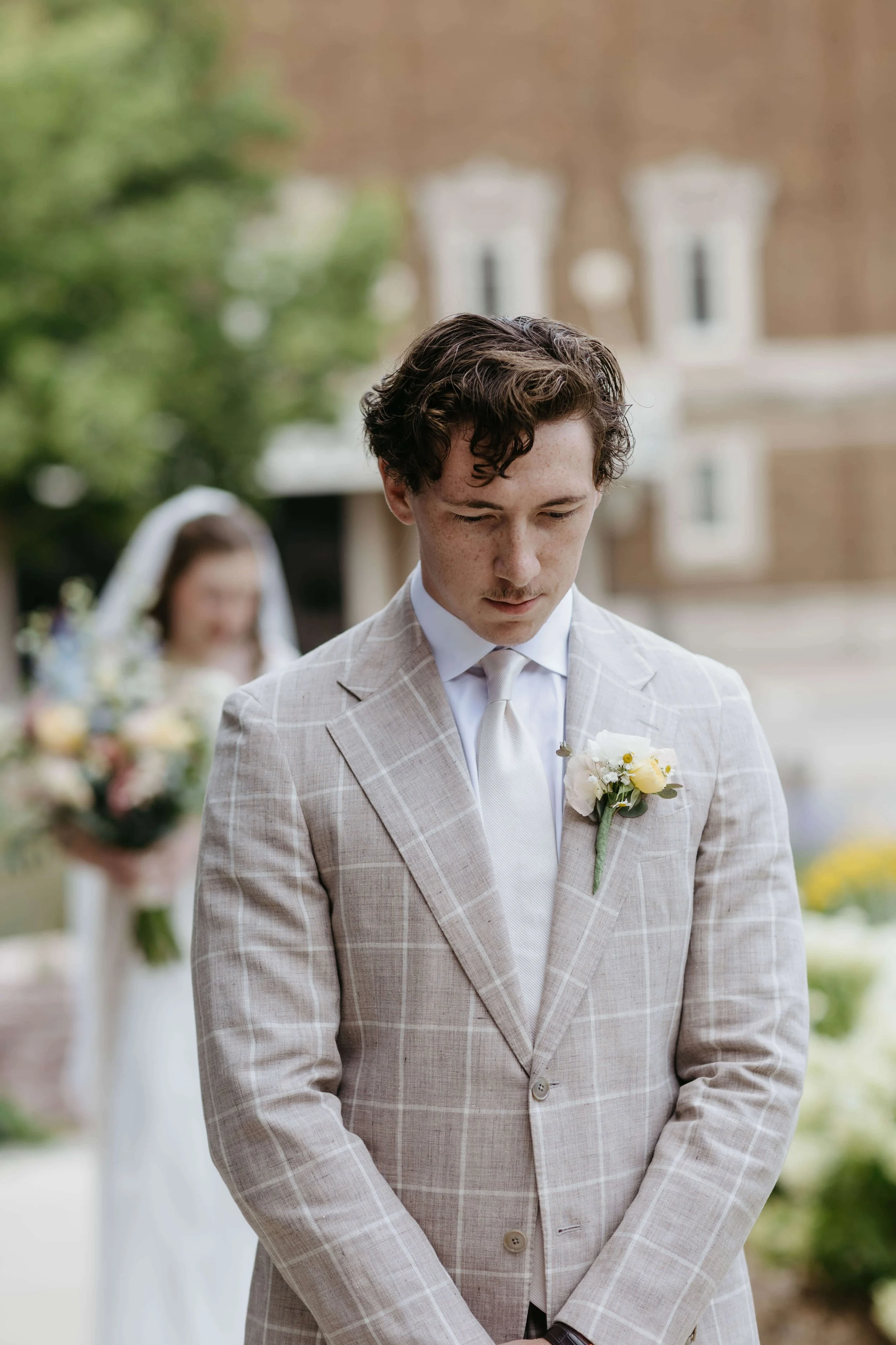 Couple doing first look at Mosaic wedding venue in downtown Sioux Falls photographed by Jenna Heckel Photography. 