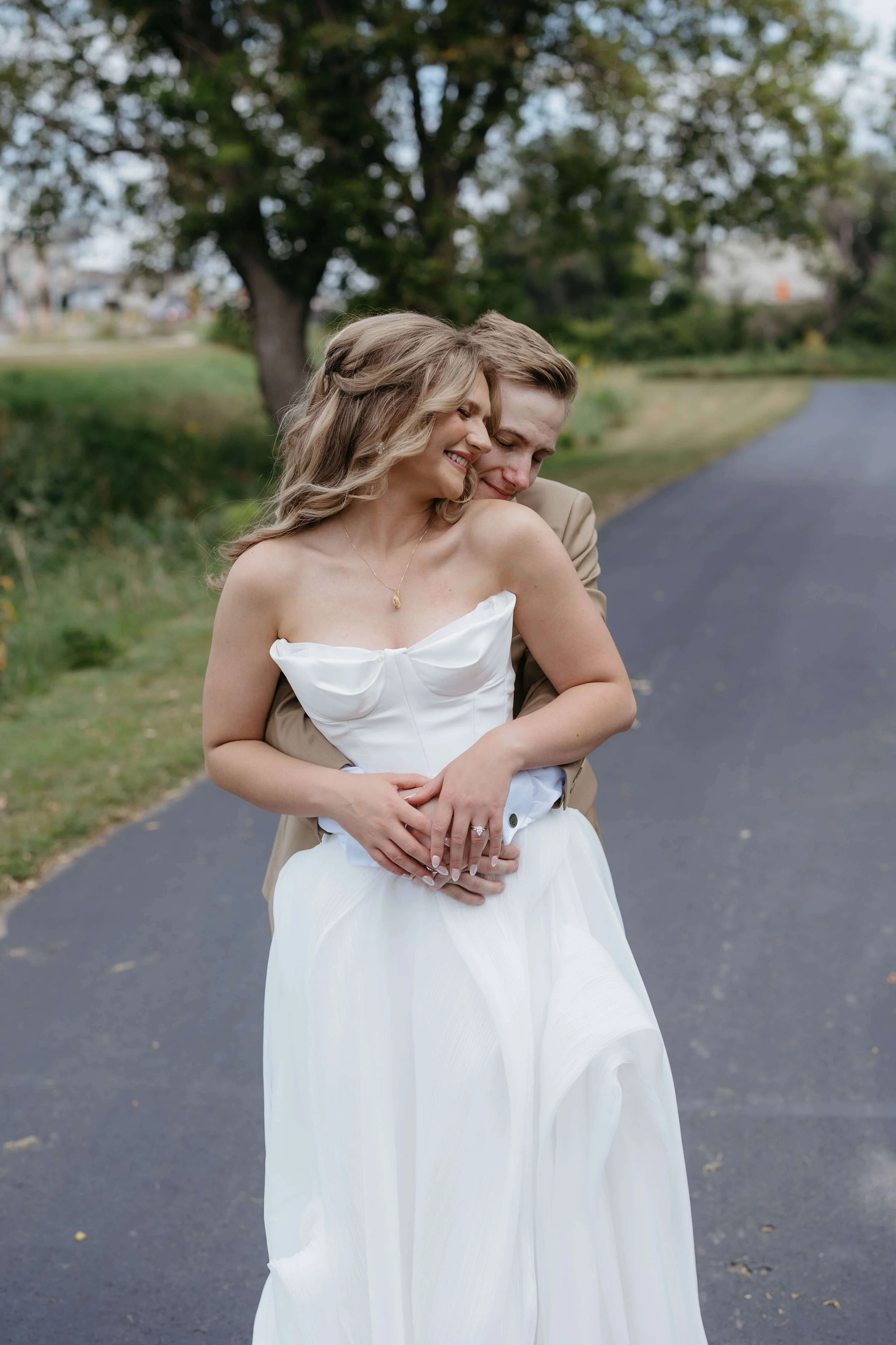 Bride and groom doing wedding portraits at The Atrium in Sioux Falls. Photographed by Jenna Heckel Photography.