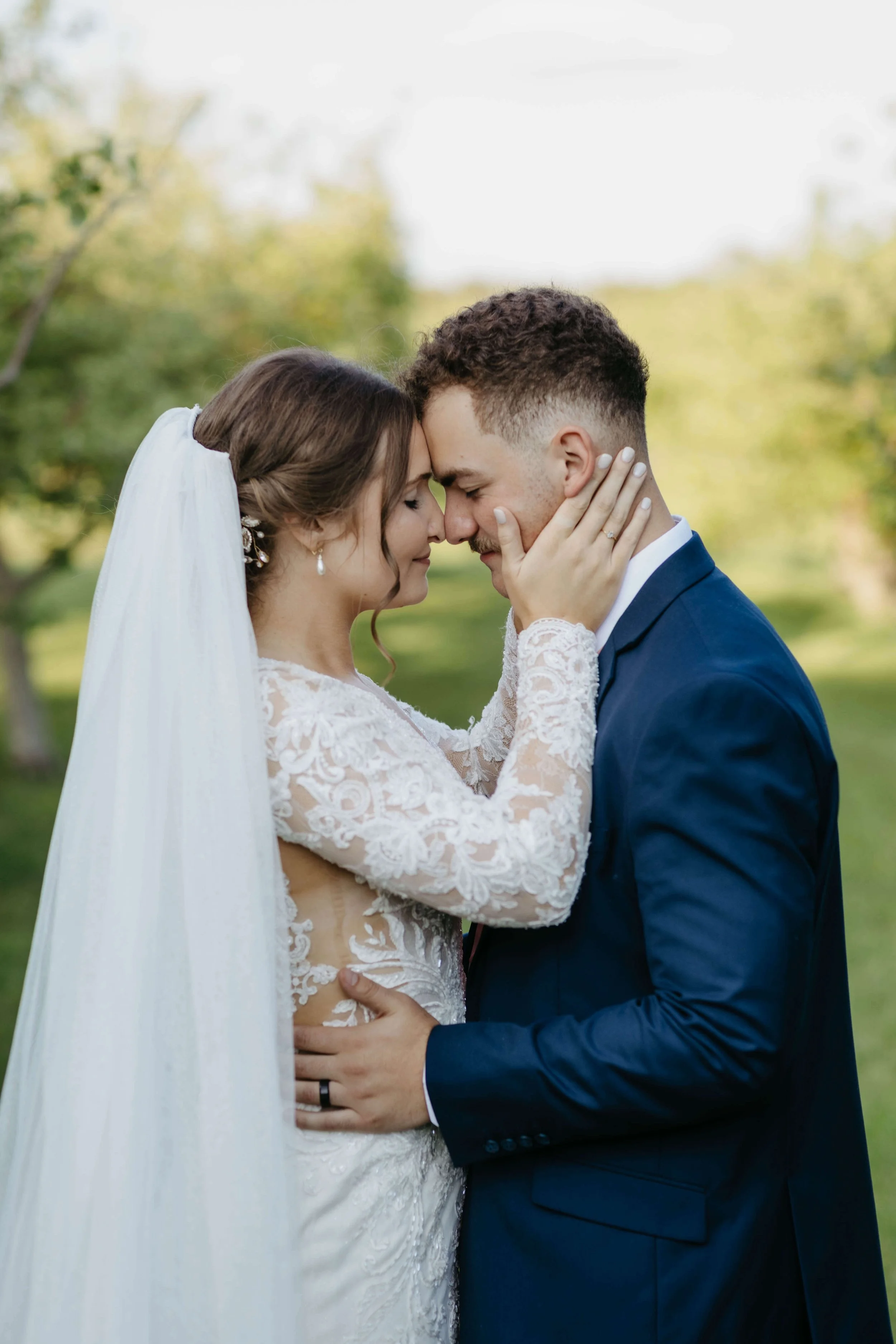 Bride and groom doing dreaming sunset portraits at The Meadow barn in Harrisburg South Dakota, photographed by Jenna Heckel Photography.