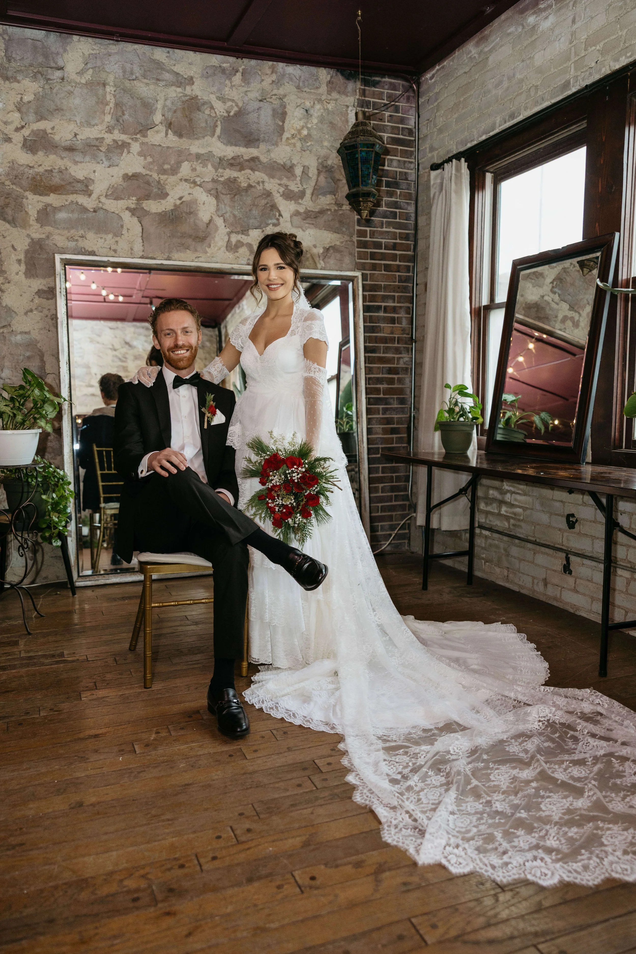 Couple on their micro wedding day posing for a photo at The Icon in downtown Sioux Falls.