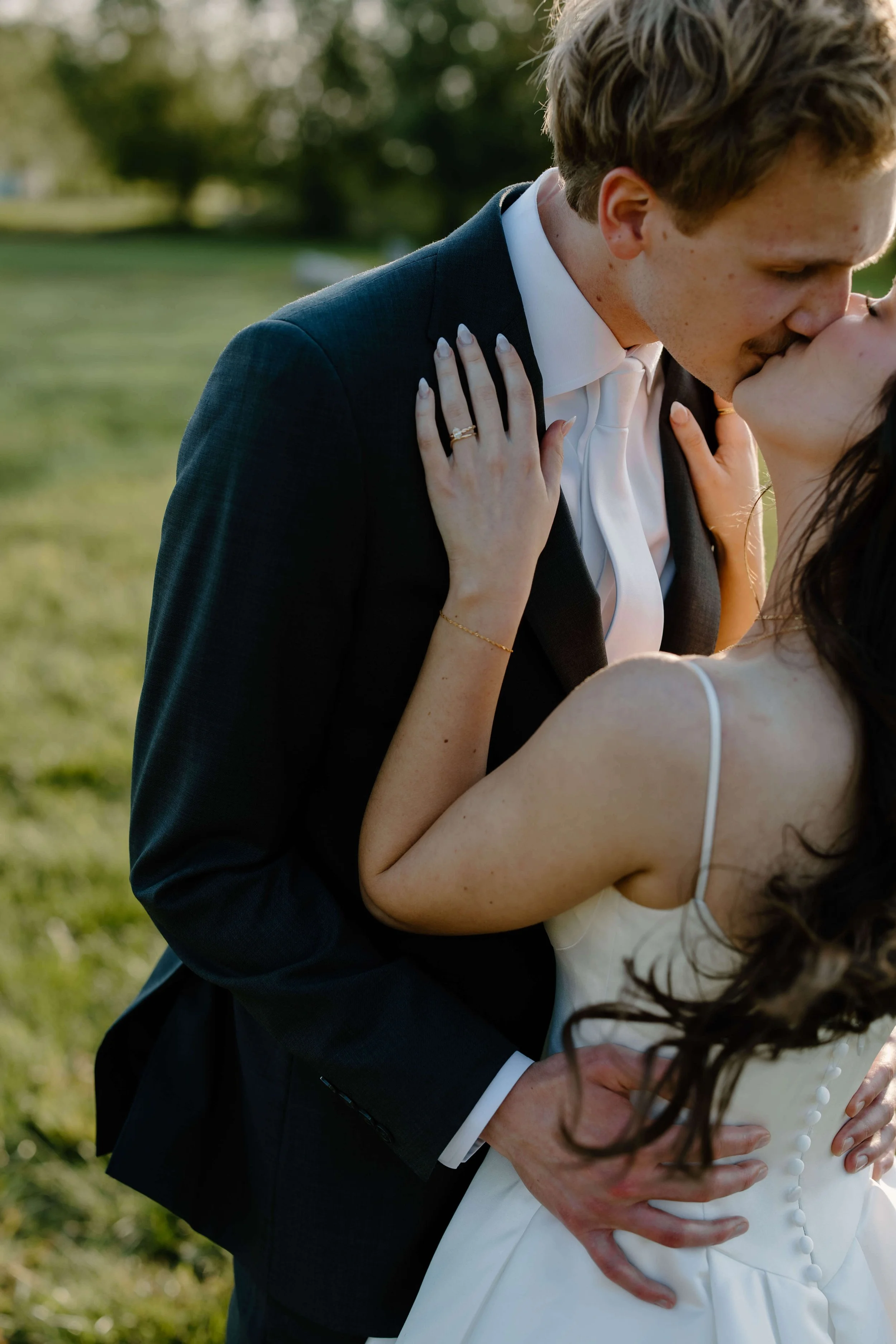 Candid portraits of bride and groom at summer wedding on their wedding day at The Atrium in Sioux Falls, photographed by Jenna Heckel Photography.