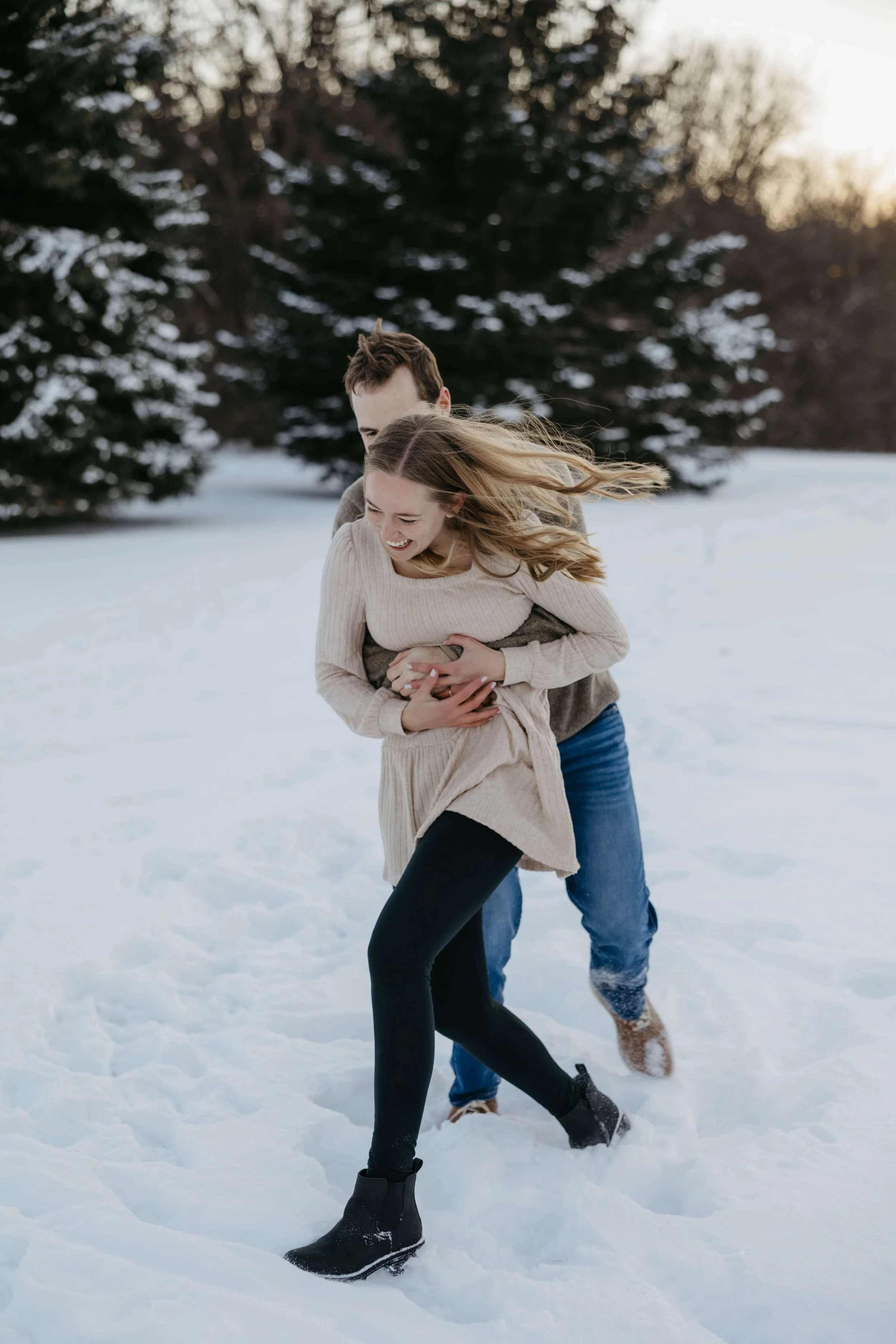 Winter engagement session in Sioux Falls at the outdoor campus with Jenna Heckel Photography.