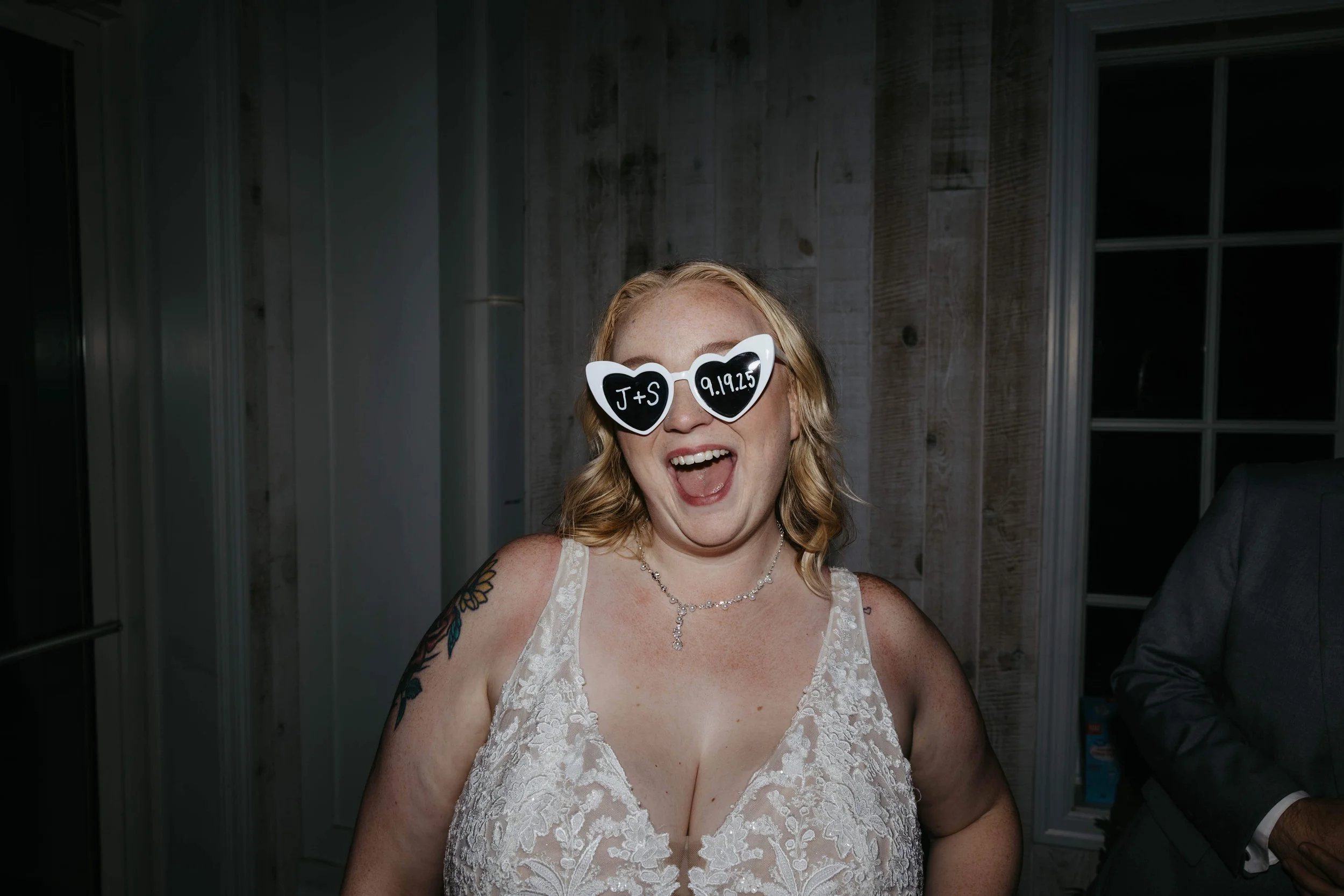 Bride and groom during their reception at Laural Ridge Barn in Sioux Falls, South Dakota. Photographed by Jenna Heckel Photography. 