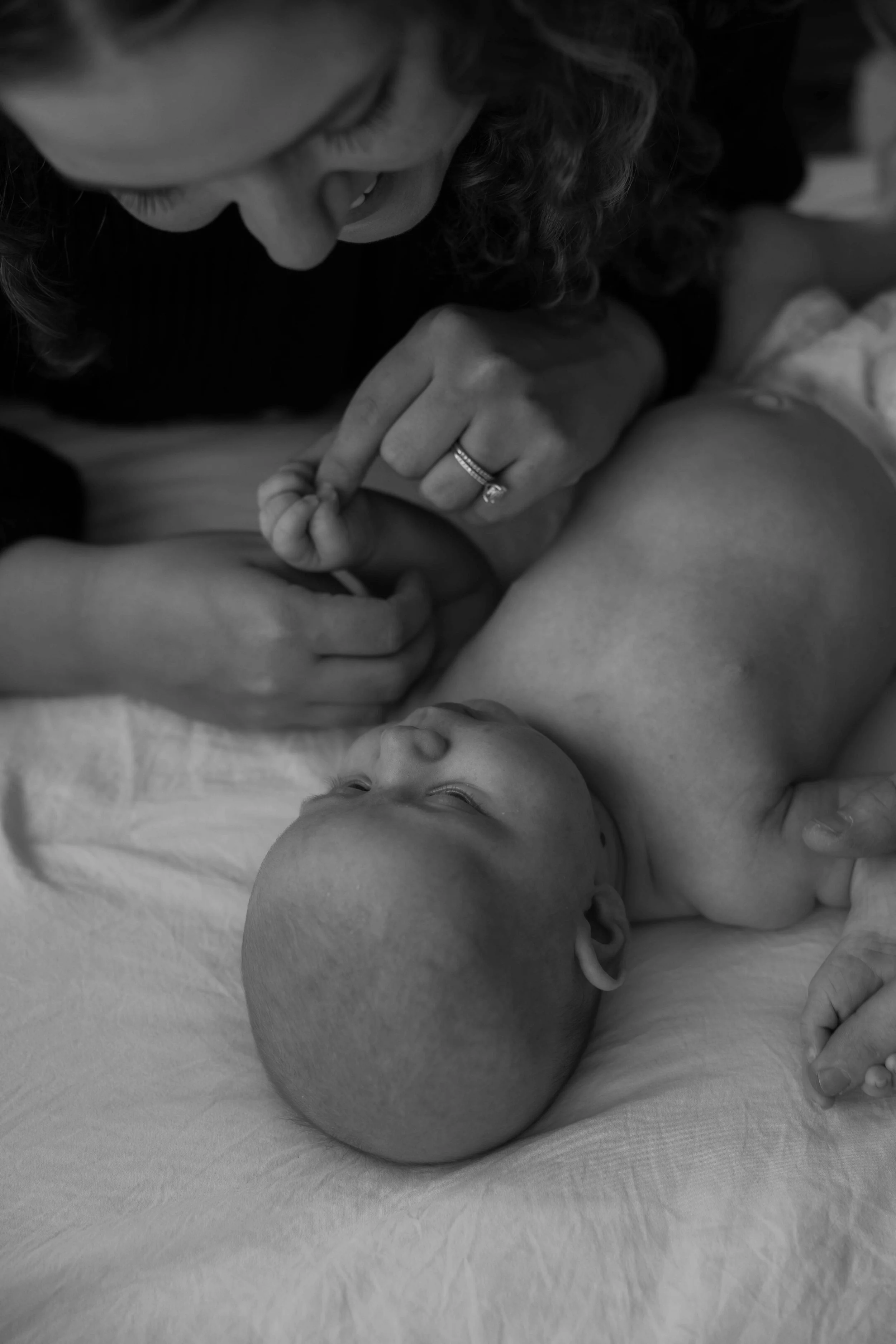 Mom with newborn baby at Jenna Heckel Photographys studio.