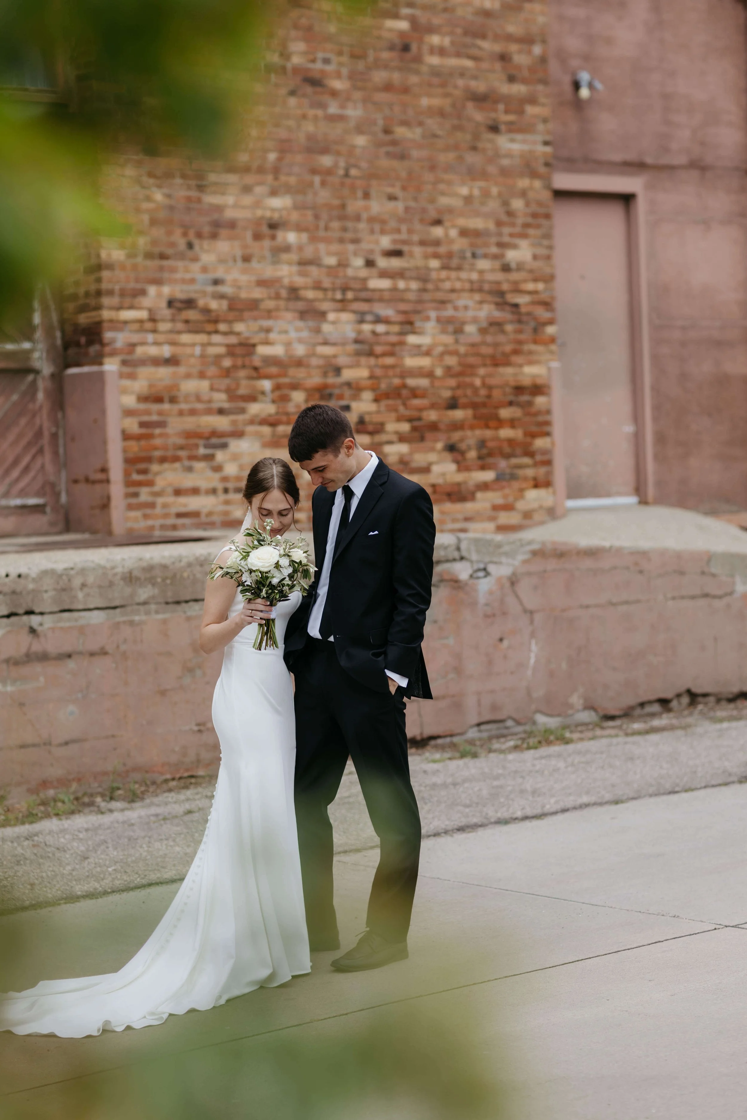 Couple having an emotional first look on their wedding day in Yankton South Dakota photographed by Jenna Heckel Photography.