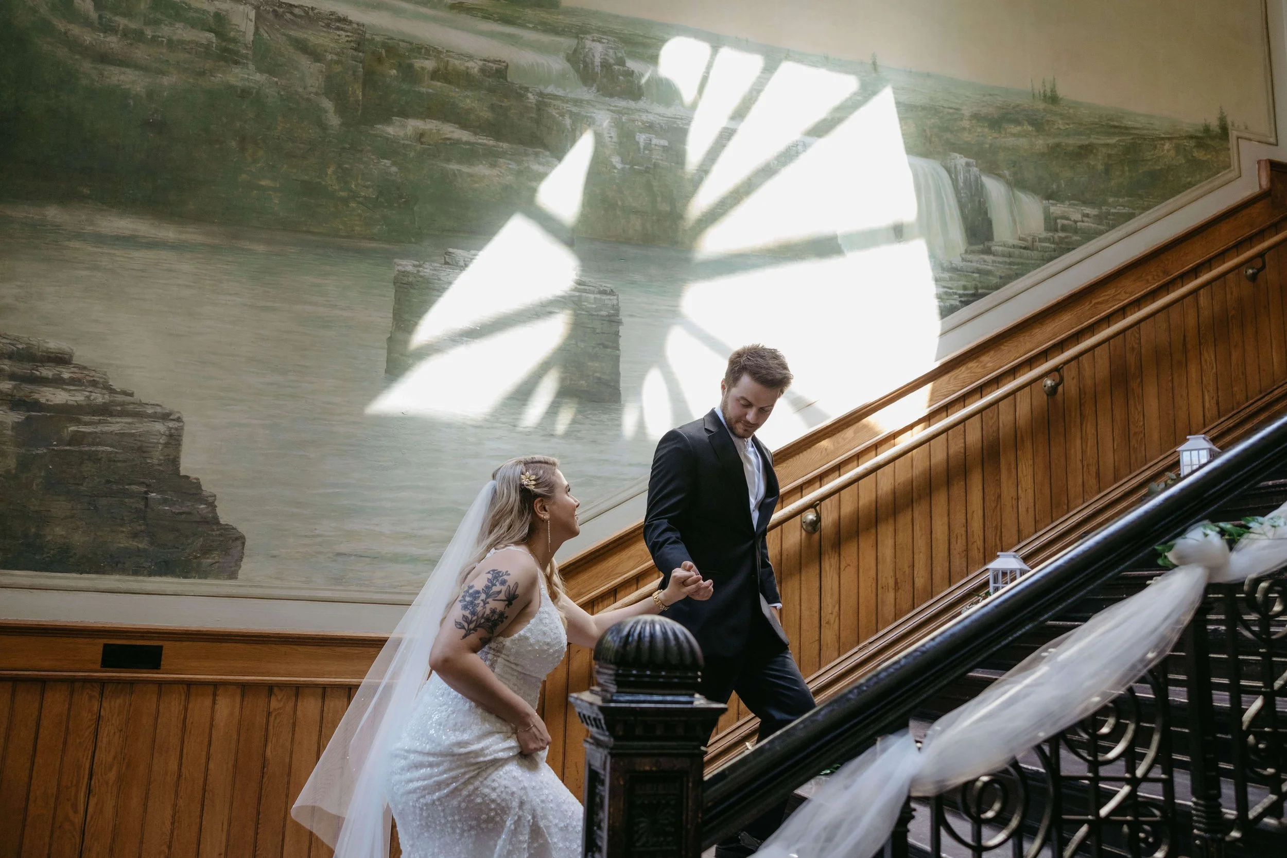 Couple being photographed on their wedding day at the old courthouse museum in downtown Sioux Falls by Jenna Heckel Photography.