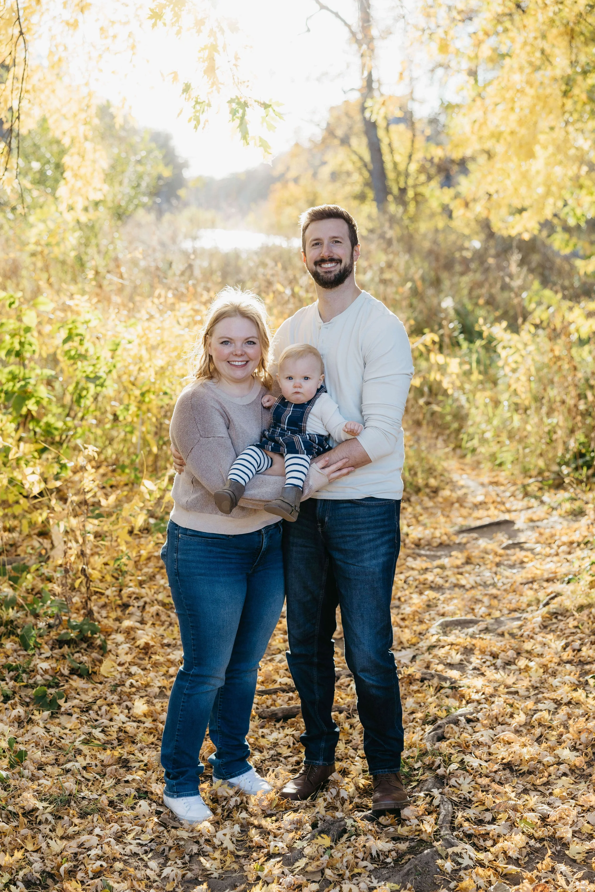 Family of Three at the Palisades State Park near Sioux Falls, South Dakota doing fall family photos.