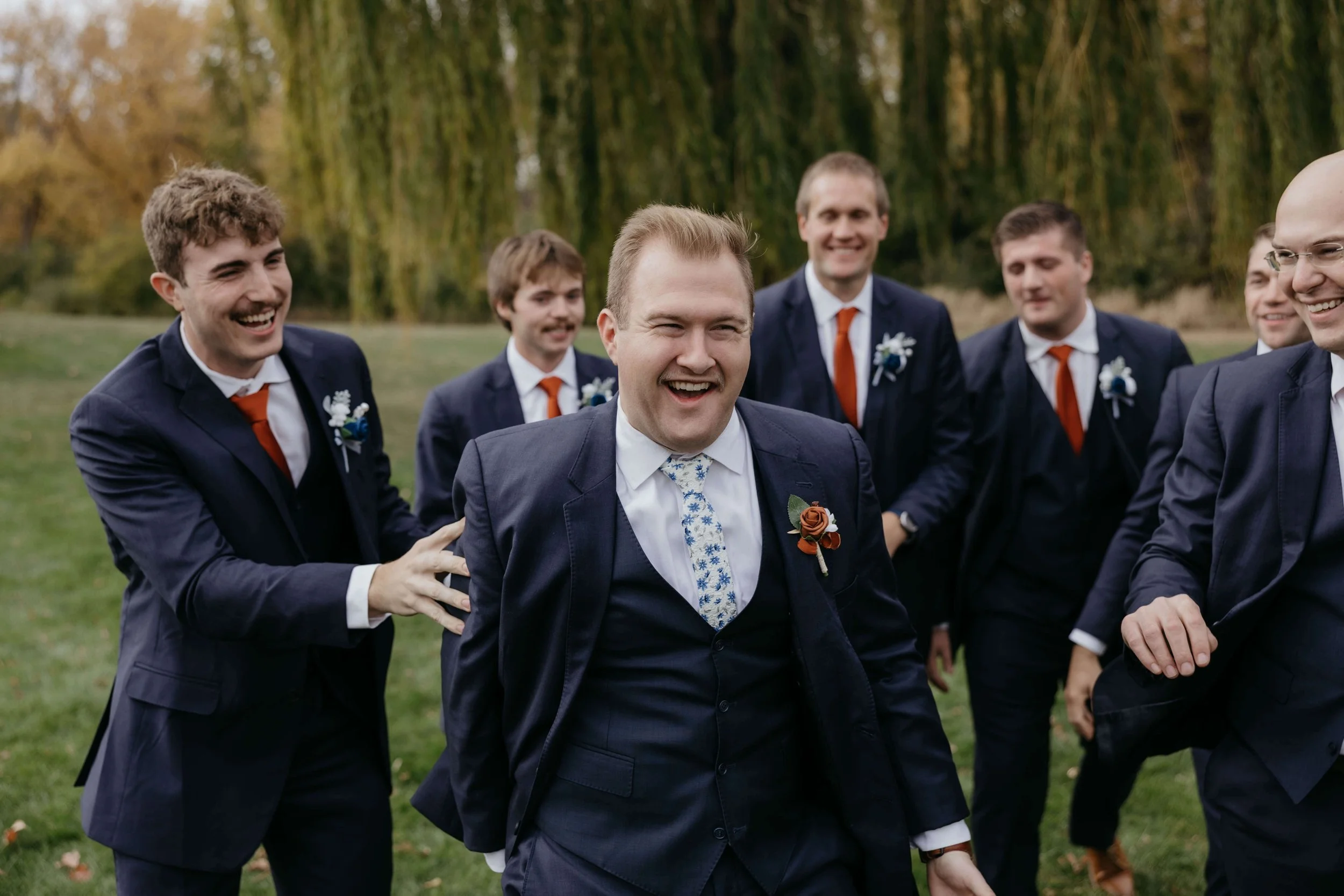 Couple doing wedding party photos at the outdoor campus in Sioux Falls, South Dakota.