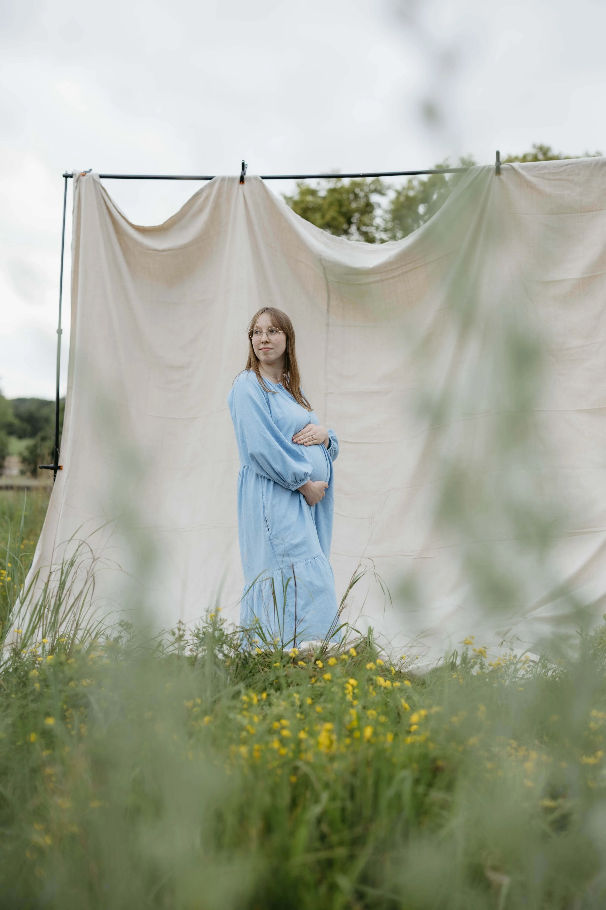Mother doing maternity photos at Mary Jo Wegner near Sioux Falls, South Dakota. Photographed by Jenna Heckel Photography.