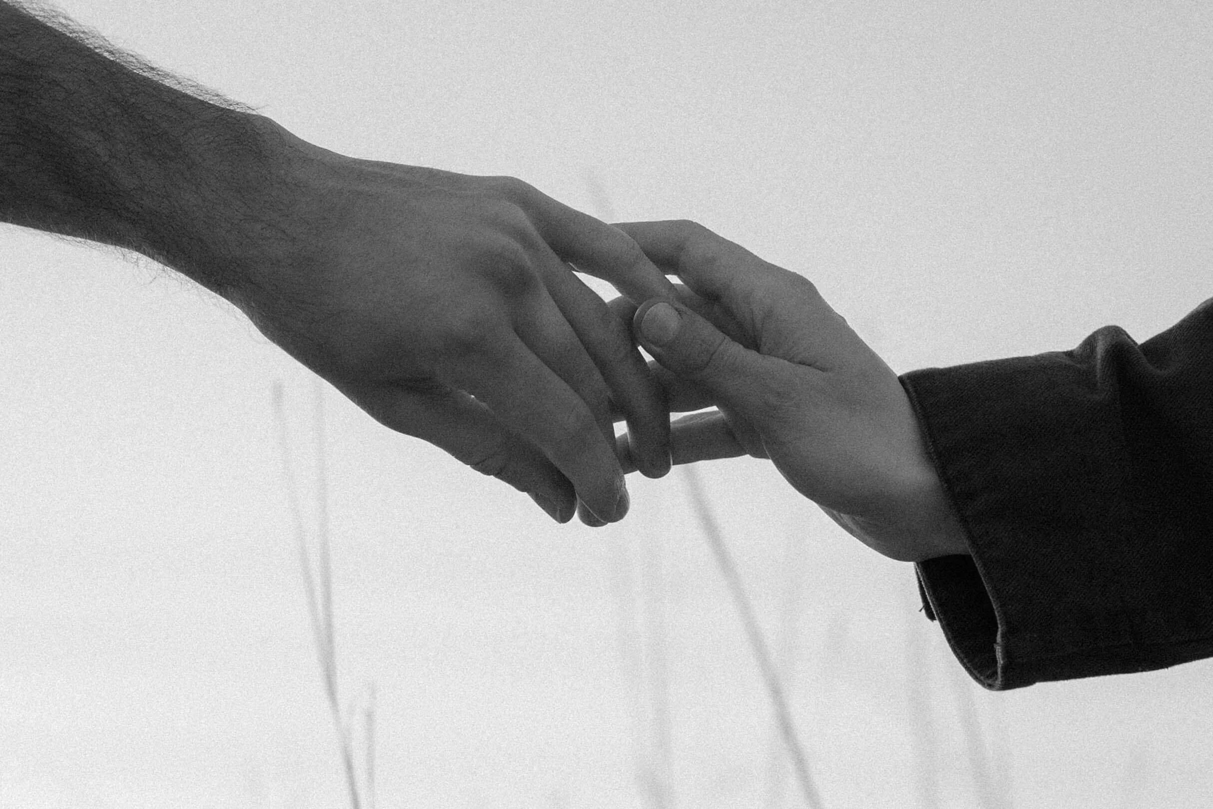 Engaged couple holding hands at their sunrise session at Good Earth State Park with Jenna Heckel Photography.