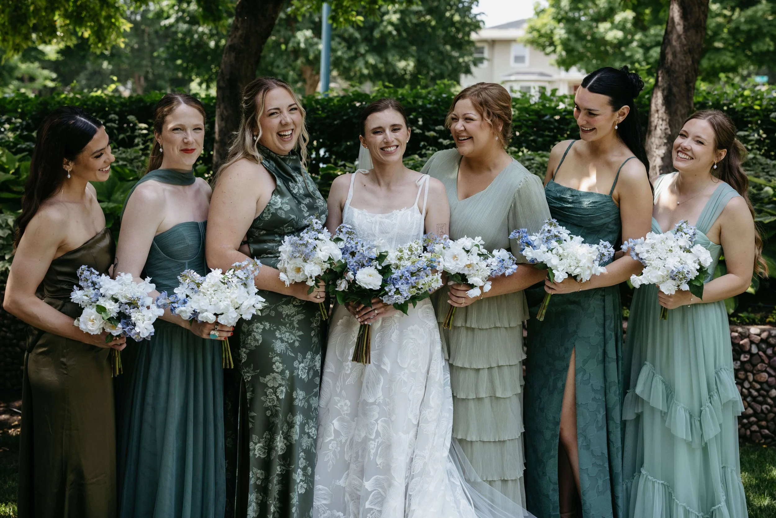 Bride with her bridesmaids in Sioux Falls, South Dakota at McKennan Park. Photographed by Jenna Heckel Photography.