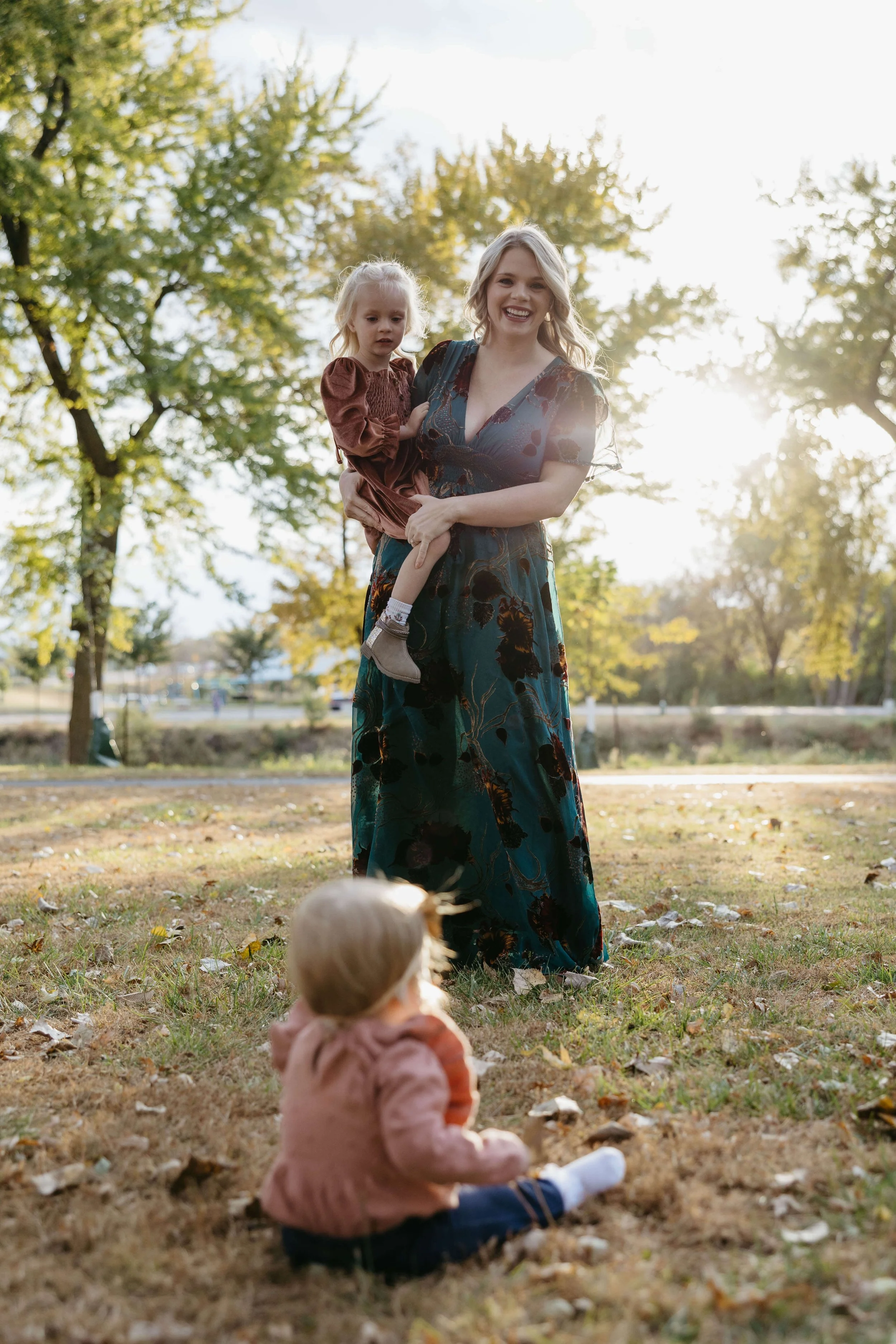 Mother and young daughters at Rotary park in Sioux Falls, SD during family photoshoot with family photographer Jenna Heckel Photography.