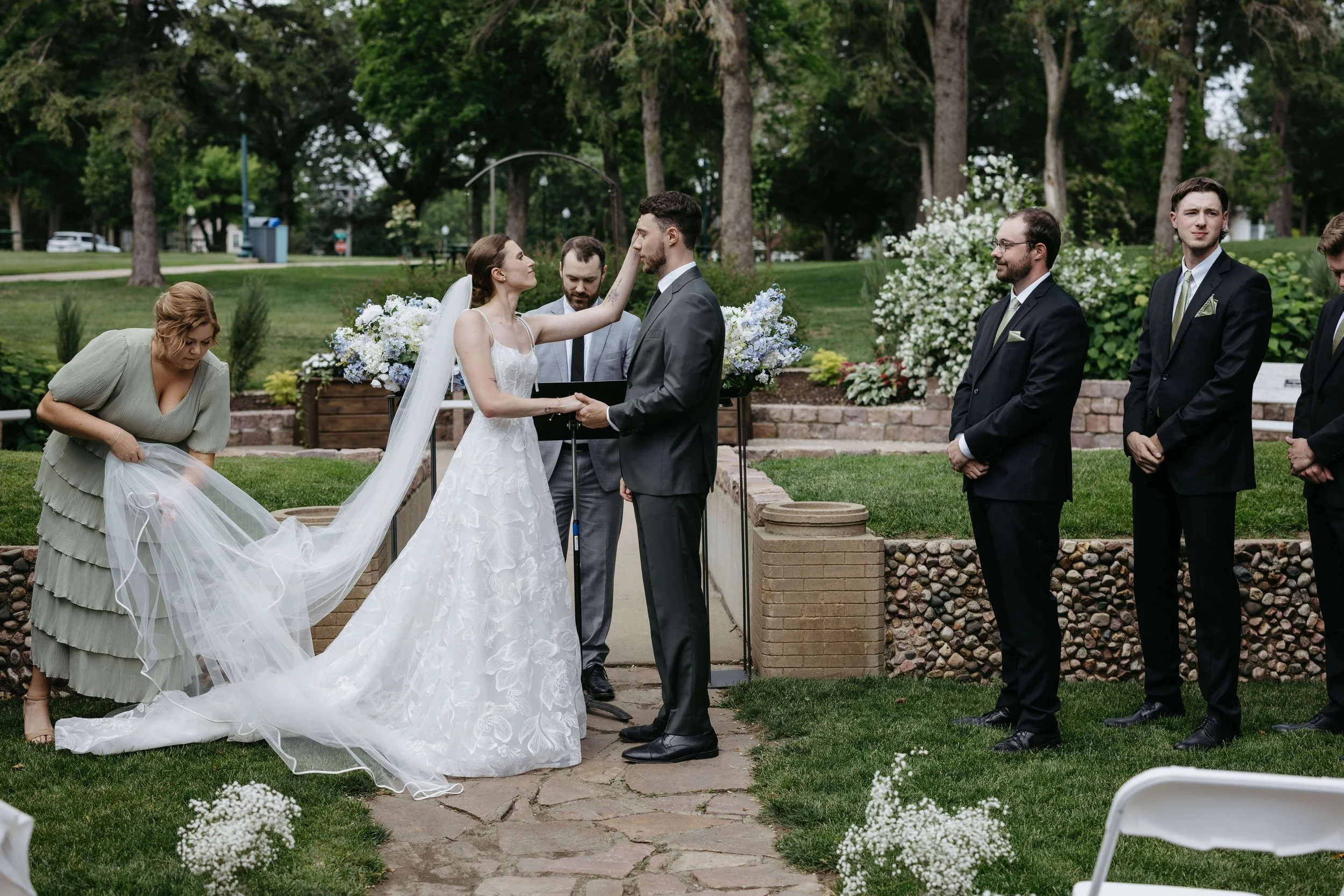 Couple during their wedding ceremony at McKennan park in the historic district of Sioux Falls.