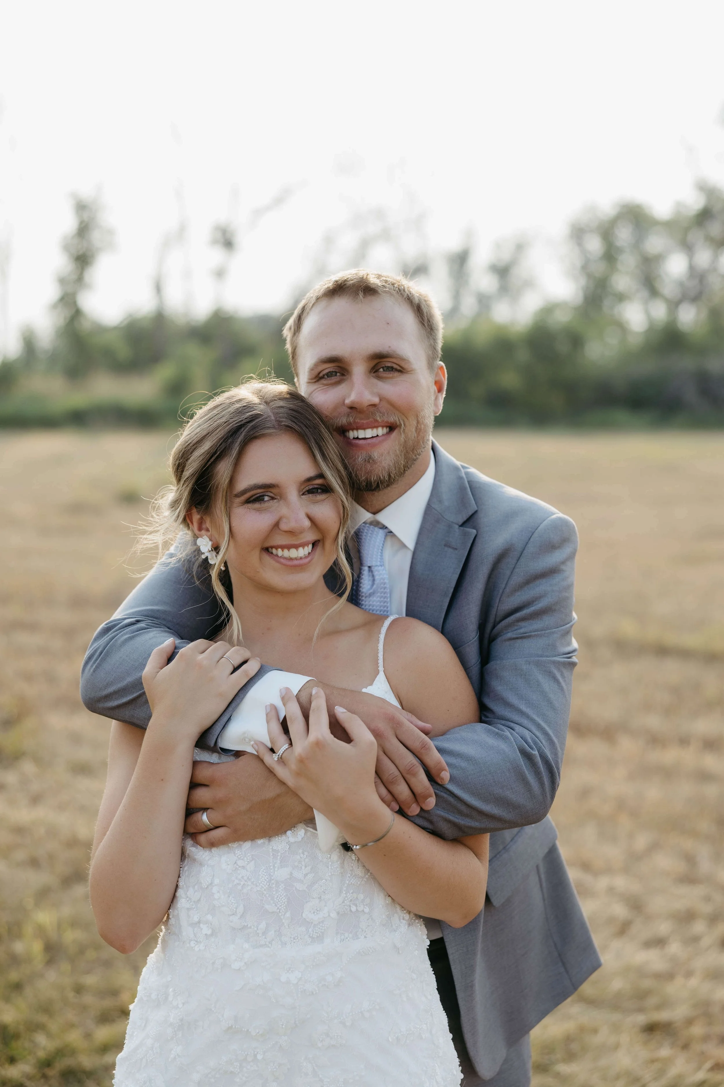 Couple taking sunset portraits in Mitchell South Dakota on their wedding day photographed by Jenna Heckel Photography.