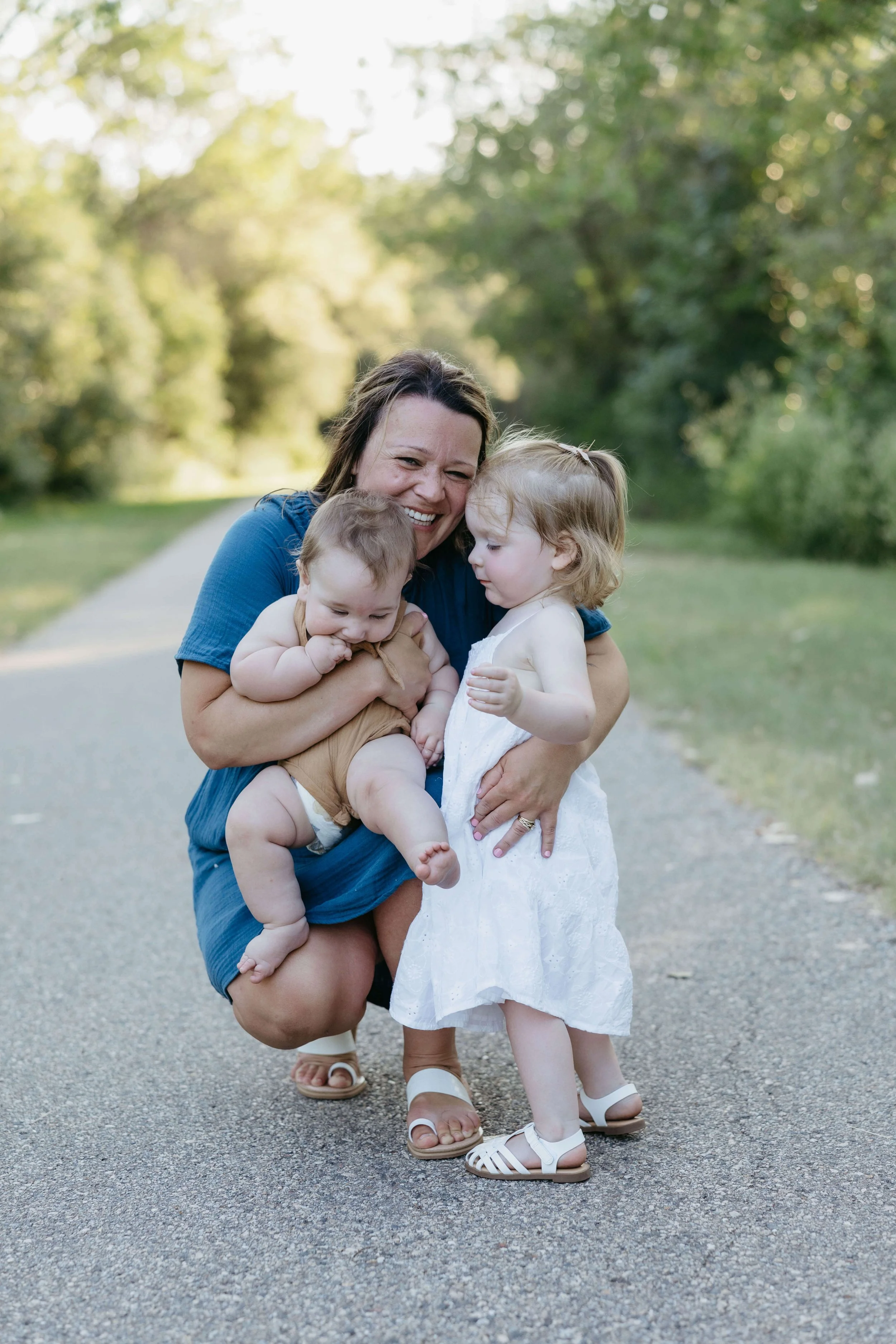 Family doing summer family pictures near Brookings, South Dakota at sunset. Photographed by Jenna Heckel Photography.