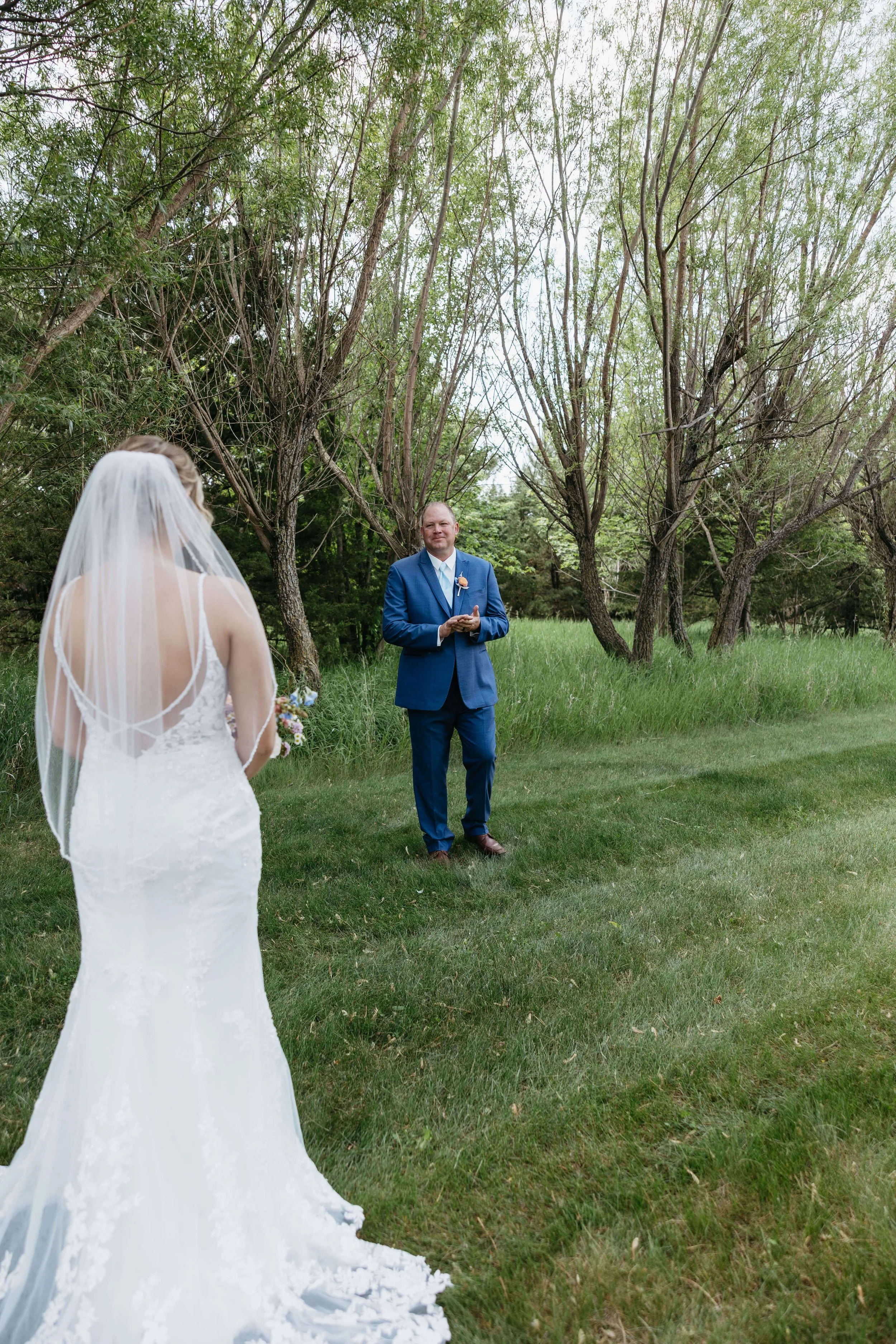 Bride doing first look with her dad on her wedding day at Granite Springs Lodge near Mitchell South Dakota, photographed by Jenna Heckel Photography.