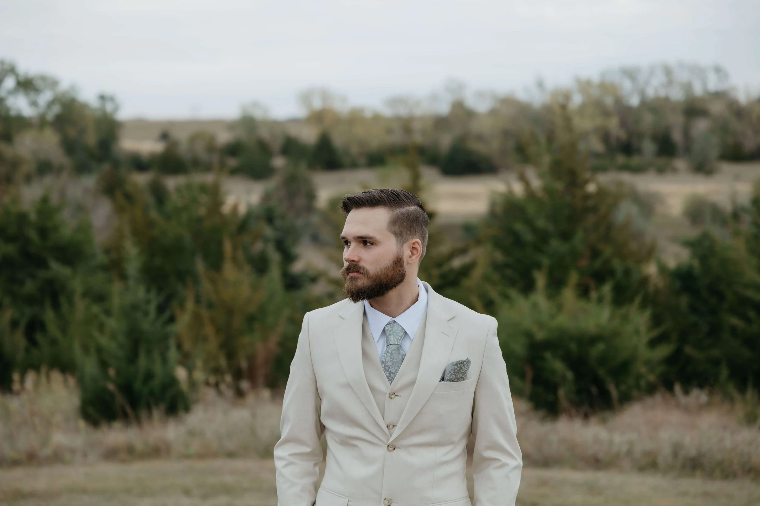 Groom getting ready at Granite Springs Lodge near Mitchell South Dakota photographed by Jenna Heckel Photography.