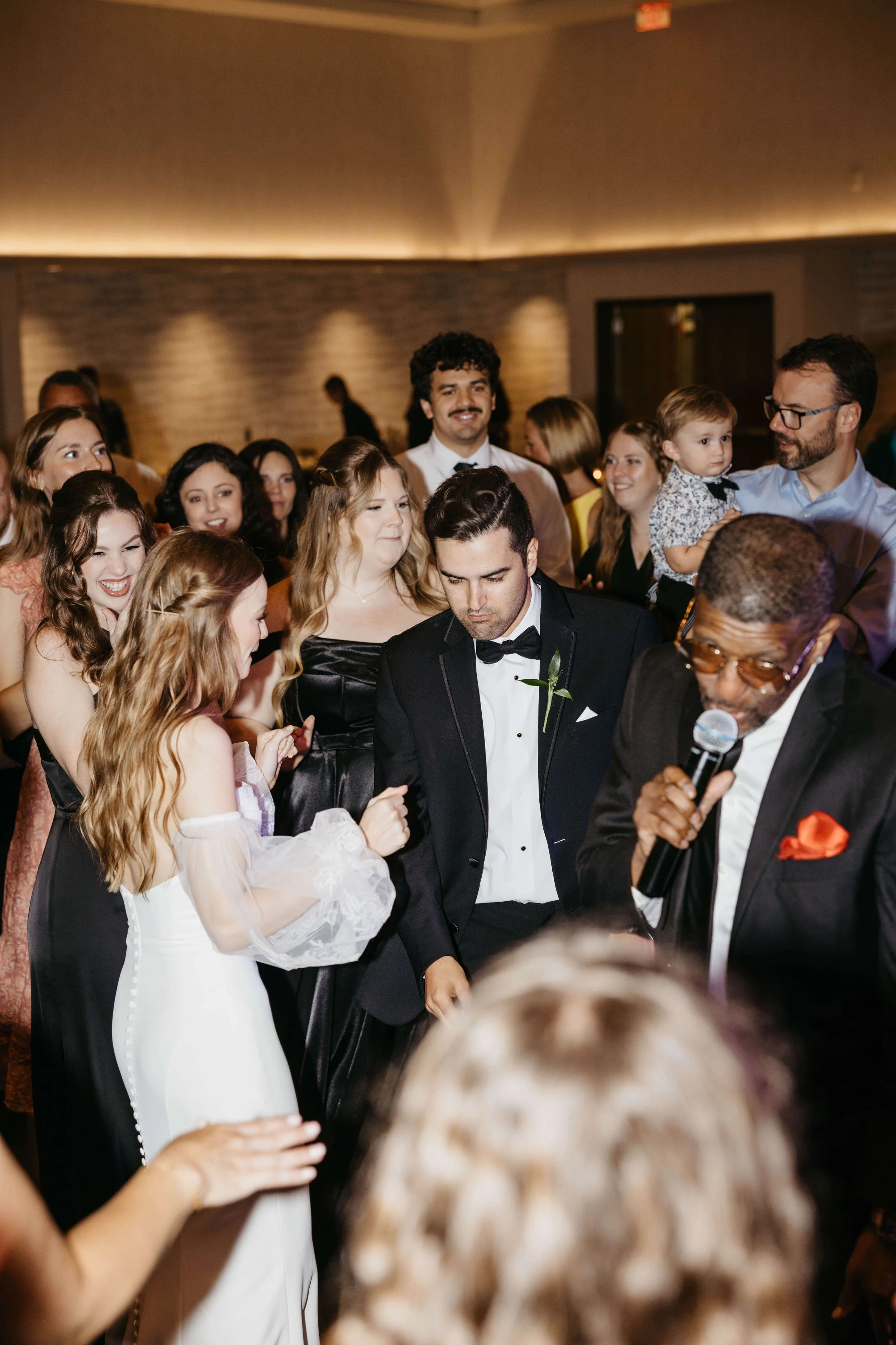 Couple dancing during their reception at downtown hotel to a live band. Photos taken by Jenna Heckel photography.