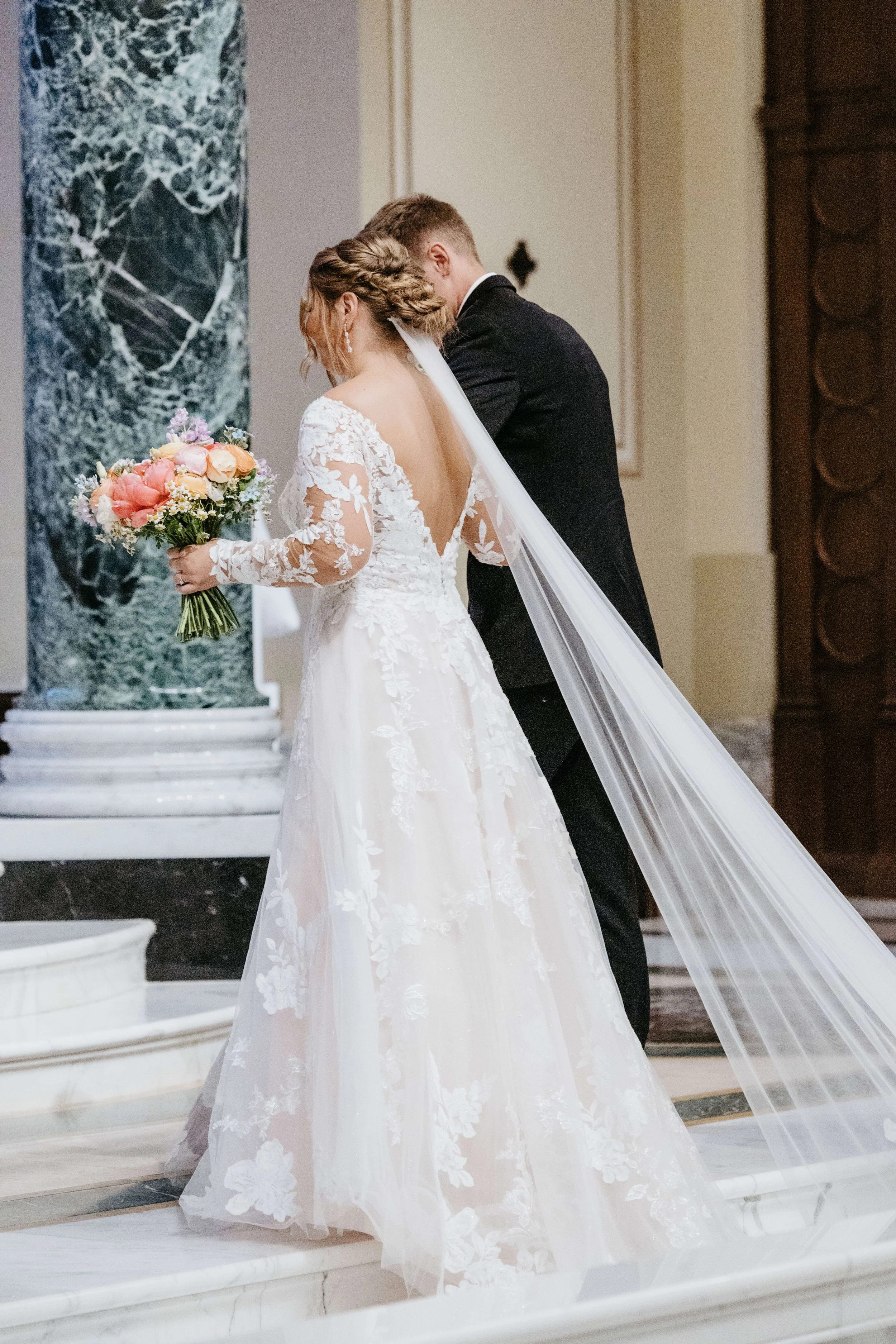Bride and groom during their Catholic ceremony at St Joesphs Cathedral in downtown Sioux Falls. Photographed by Jenna Heckel Photography.