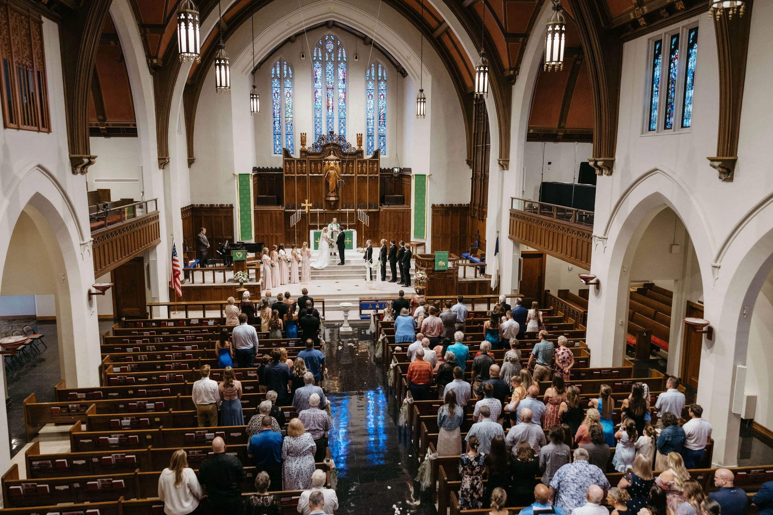 Couple on their wedding day during their ceremony at First Luthren Church in Downtown Sioux Falls.