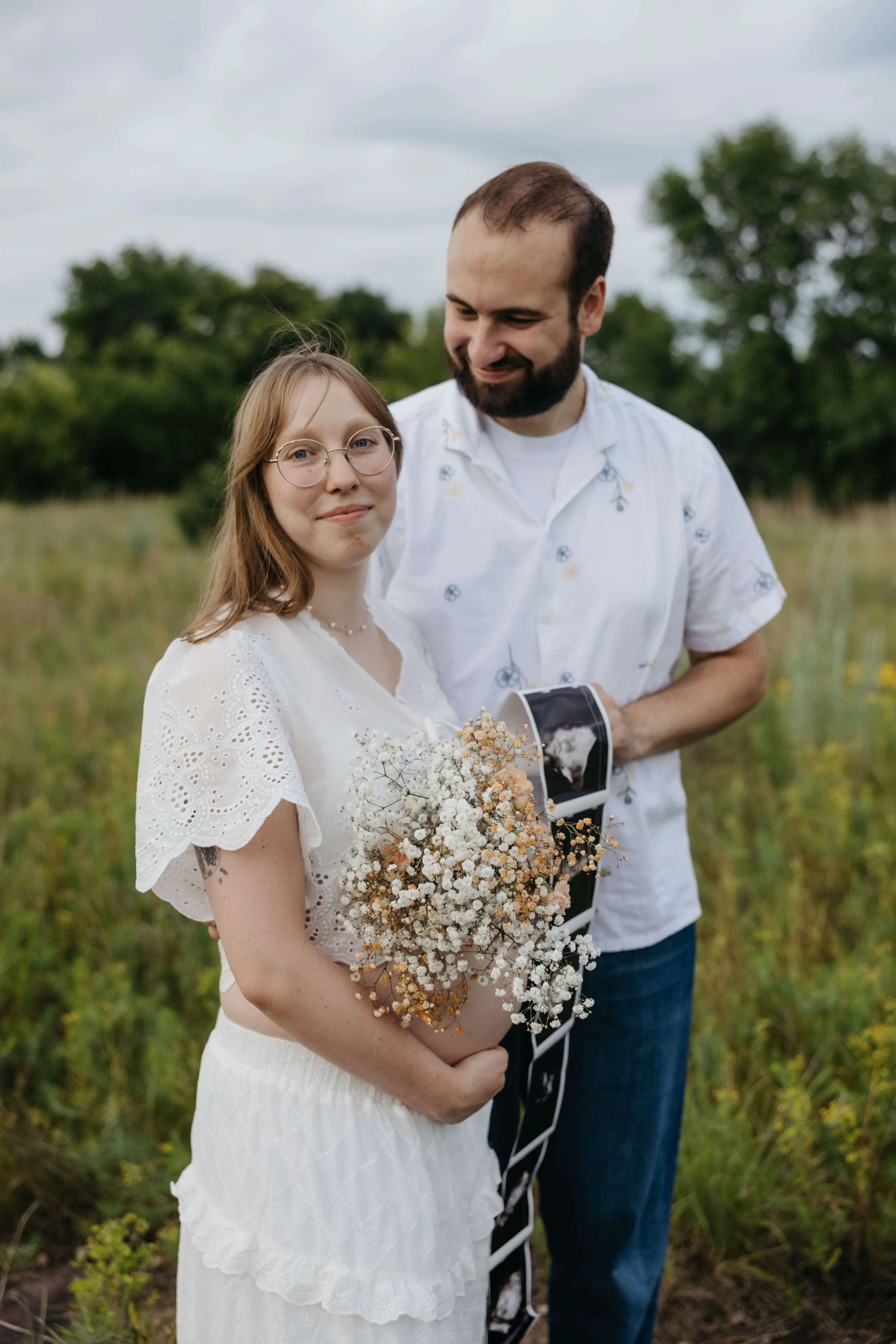 Couple doing maternity photos at sunset at Mary Jo Wegner near Sioux Falls, South Dakota. Photographed by Jenna Heckel Photography.