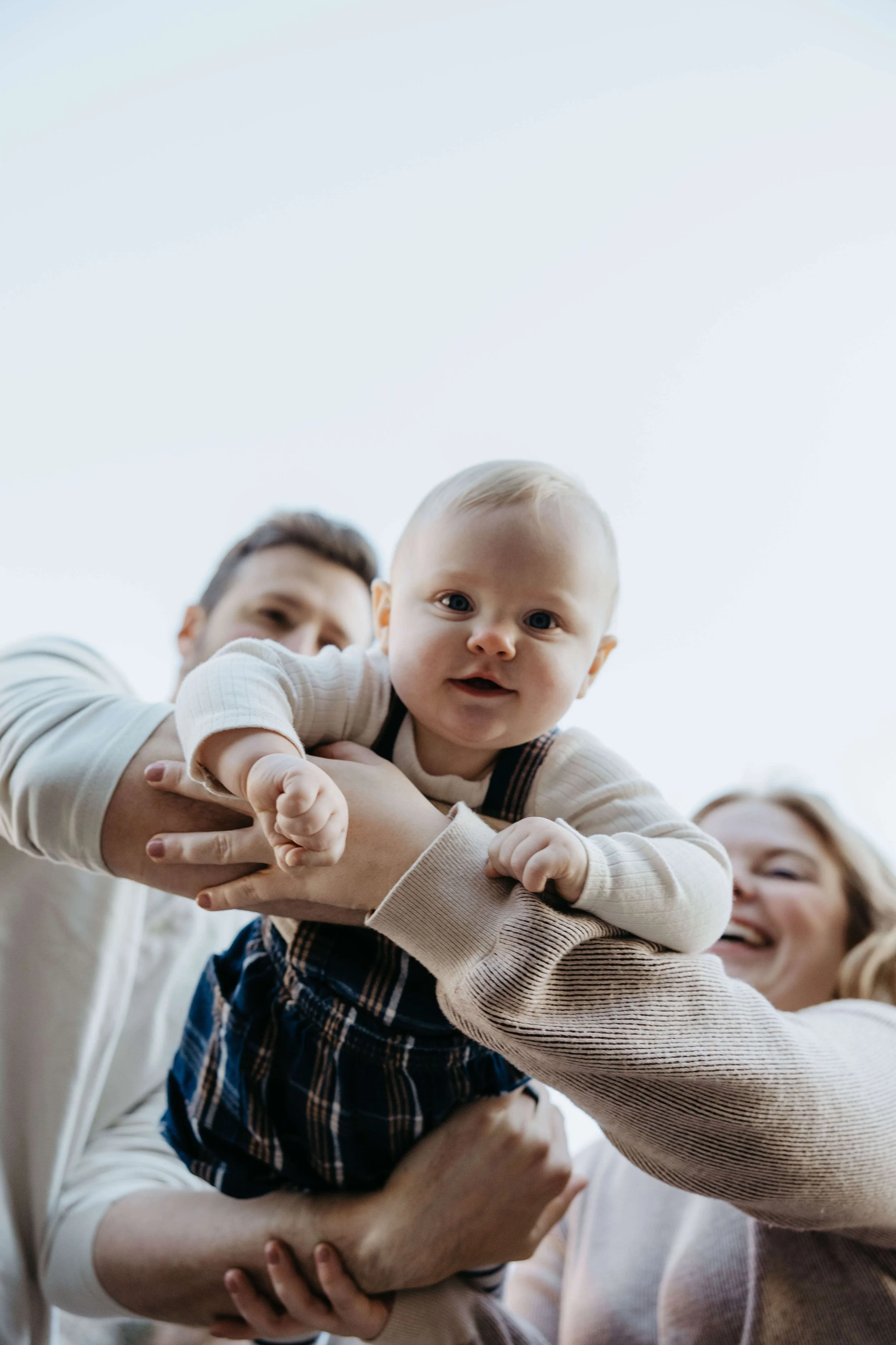 Family of Three at the Palisades State Park near Sioux Falls, South Dakota doing fall family photos.