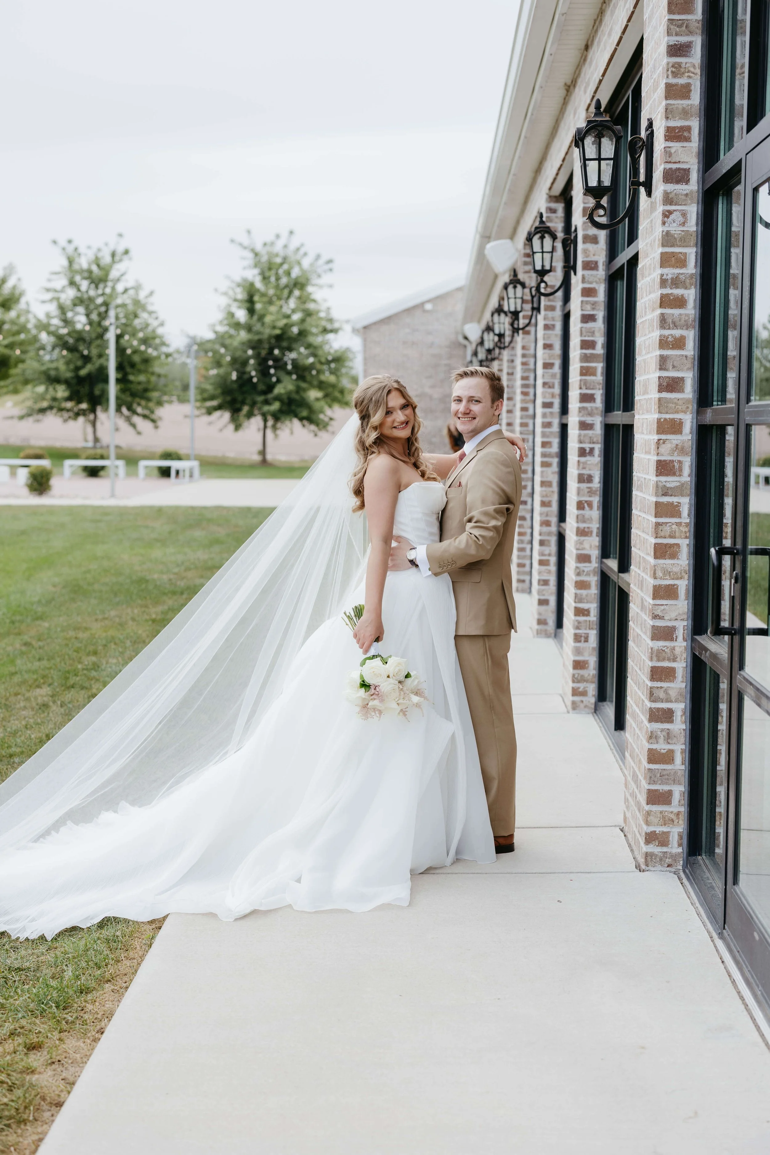Bride and groom doing wedding portraits at The Atrium in Sioux Falls. Photographed by Jenna Heckel Photography.
