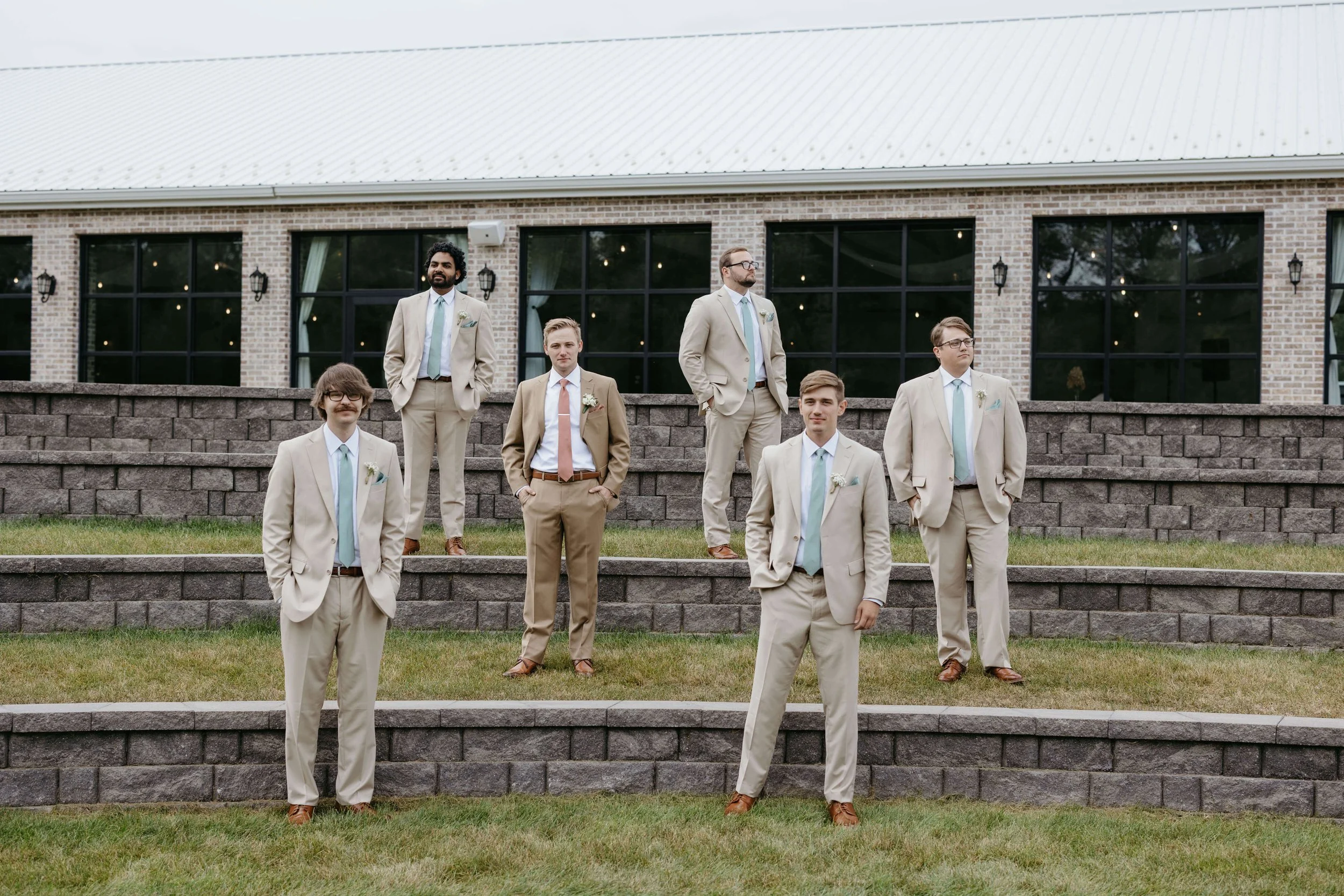Bride and groom doing wedding portraits at The Atrium in Sioux Falls. Photographed by Jenna Heckel Photography.