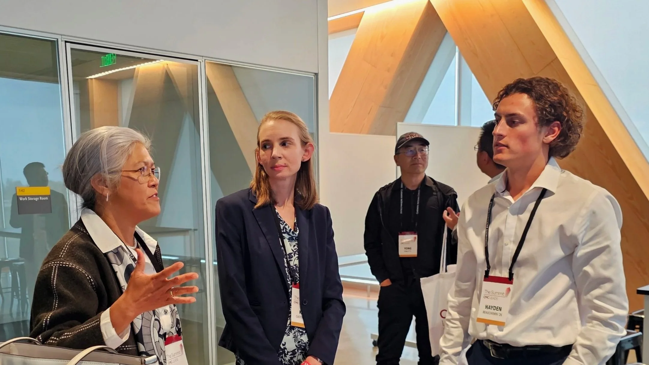 Members of the Keck Center Board of Governors (Miemie Winn Byrd '89 and Kate Castenson '10) at the CMC Leads Conference speaking with student, Hayden Beauchemin '26