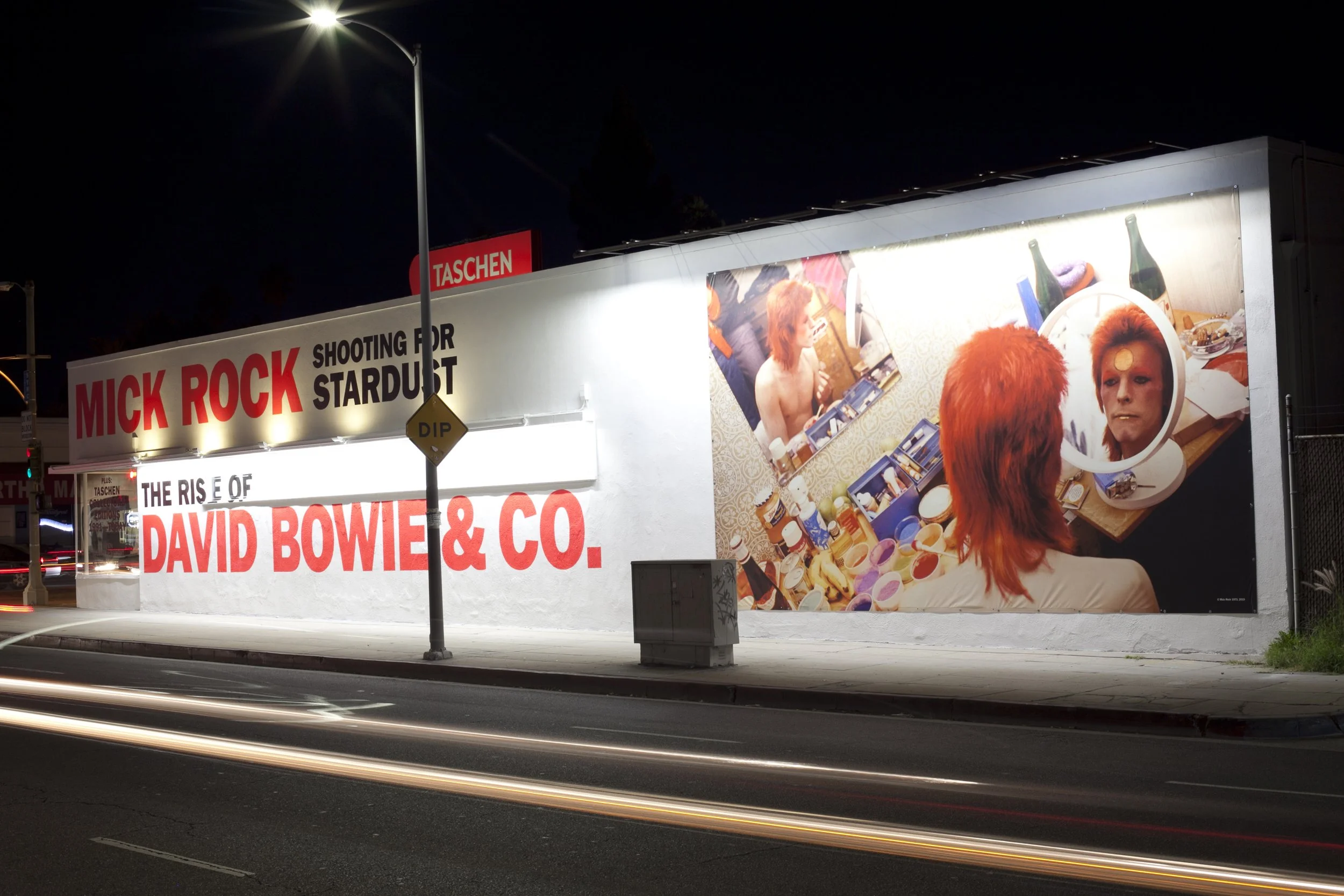 TASCHEN Gallery Los Angeles featuring Mick Rock's exhibition, "Shooting for Stardust: The Rise of David Bowie & Co." Exterior photograph by Gregory Bojorquez