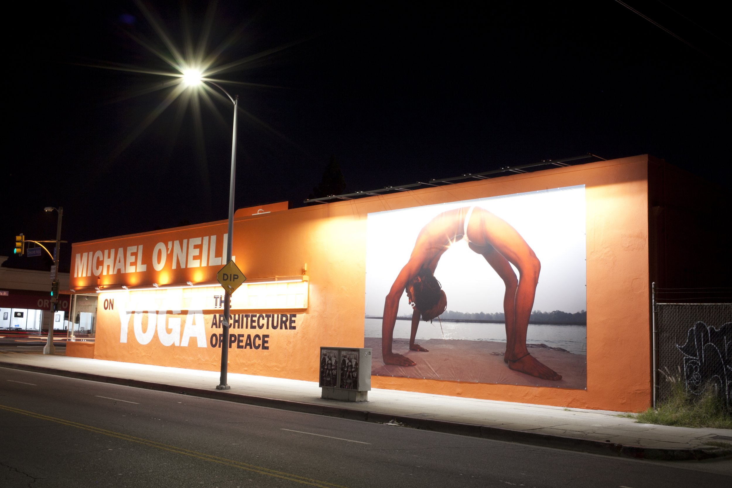 TASCHEN Gallery Los Angeles featuring Michael O'Neill's YOGA: The Architecture of Peace exhibition. Exterior photograph by Gregory Bojorquez