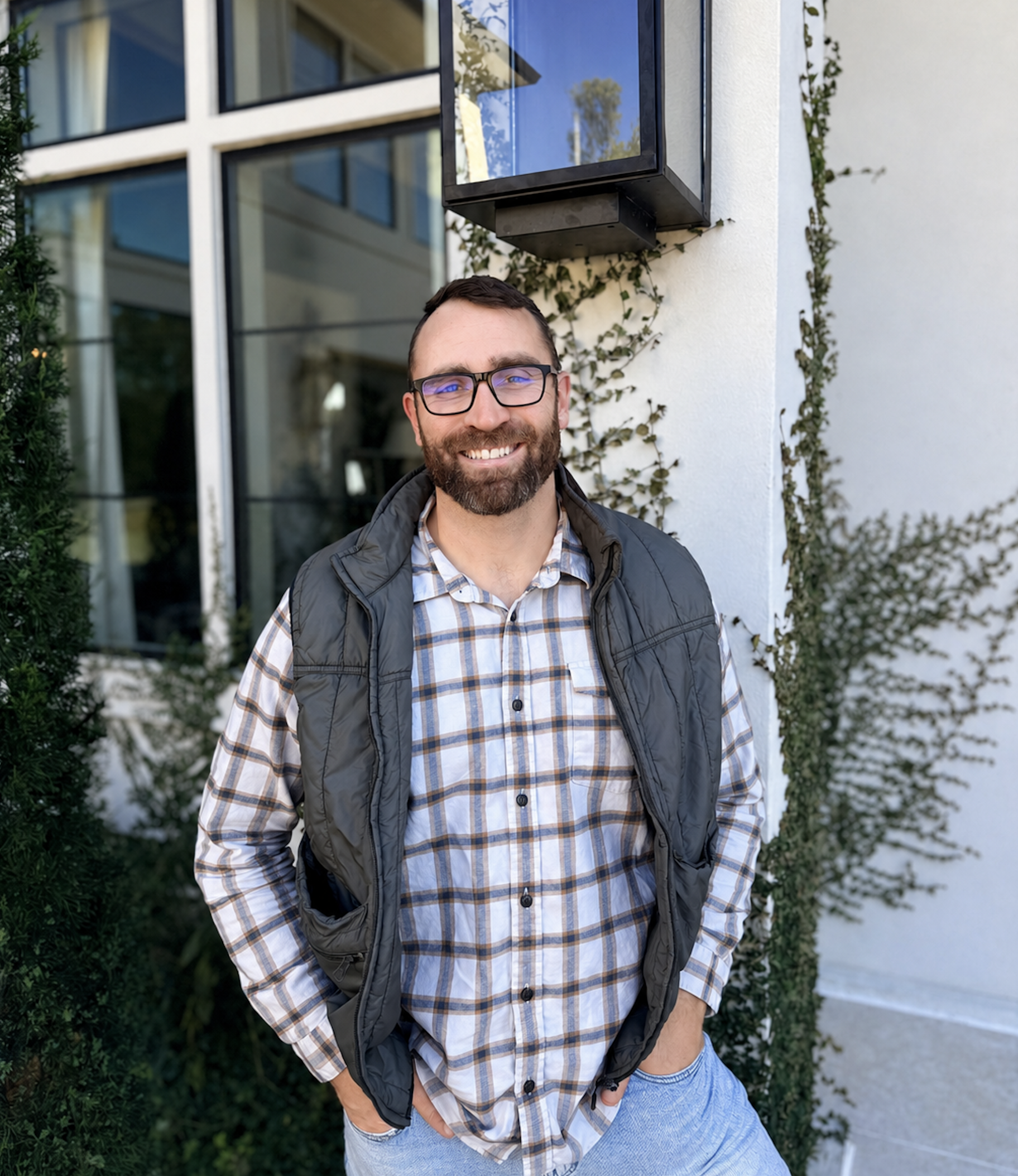 Richie Brown, founder of Beacon Builders, in front of a custom home in North Dallas-Fort Worth