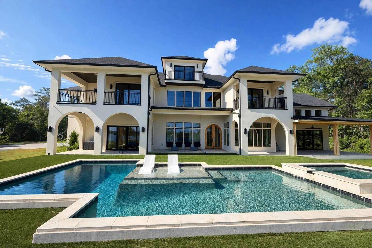 Rear exterior and pool of a finished Beacon custom home