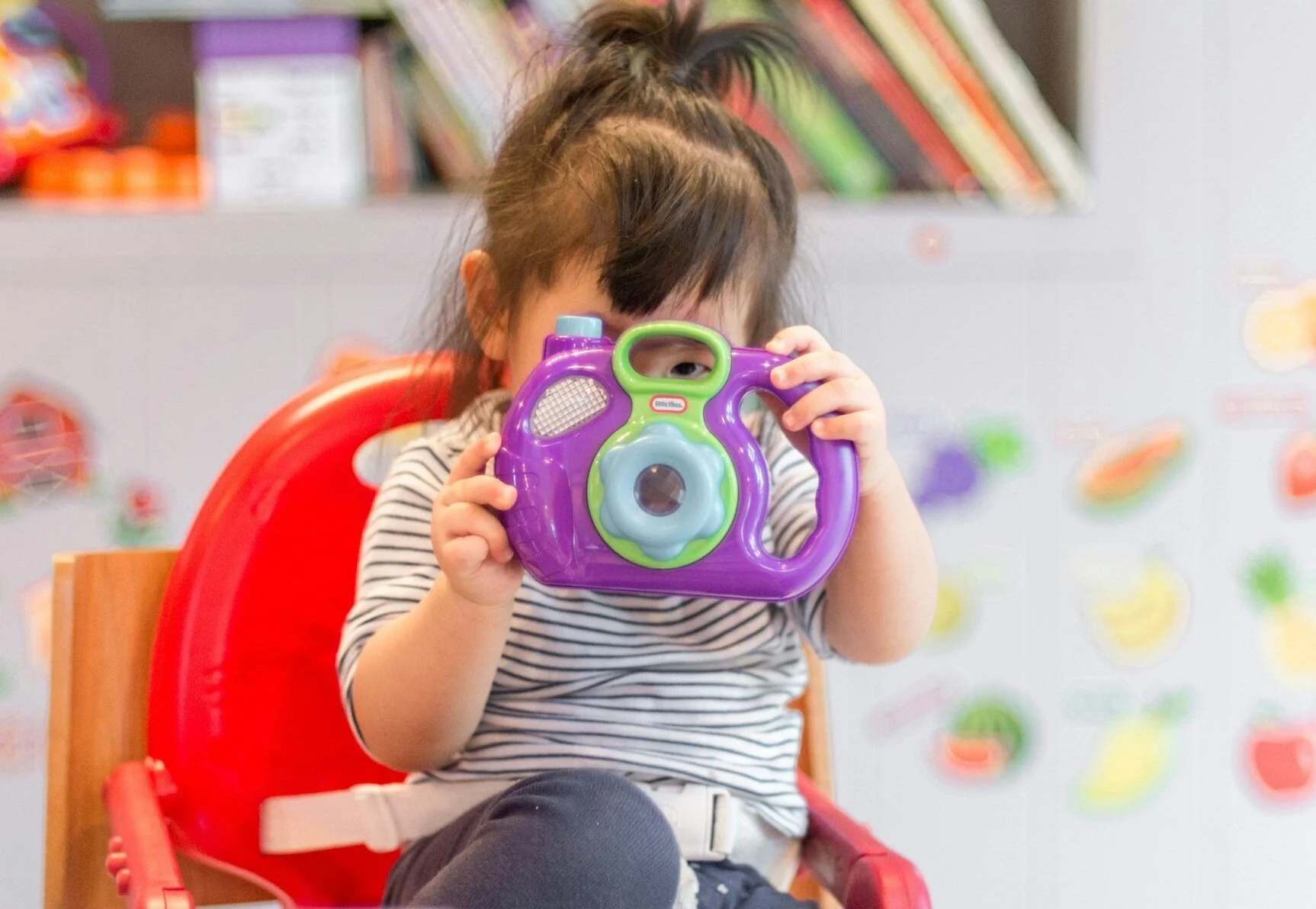 Photo of a child playing in a play therapy session with her counselor
