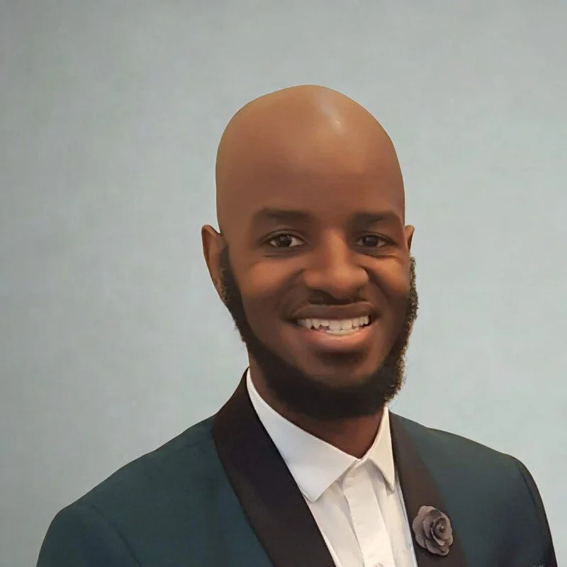 This is a photo of San Antonio Christian counselor Michael. He has on a hunter green suit jacket and white button down shirt.