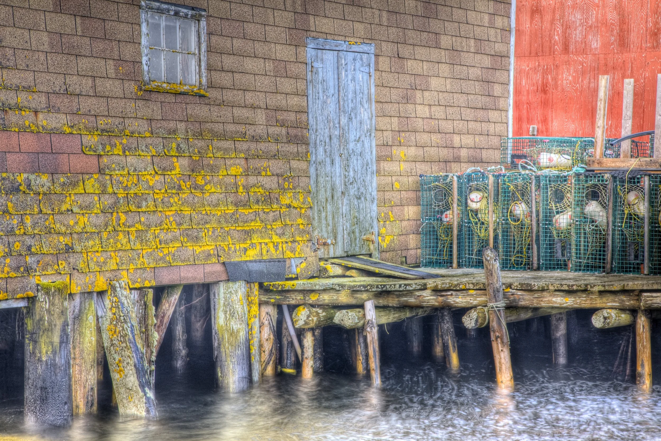 Canada, Nova Scotia, Peggys Cove, fishing shack and lobster traps, October 2009