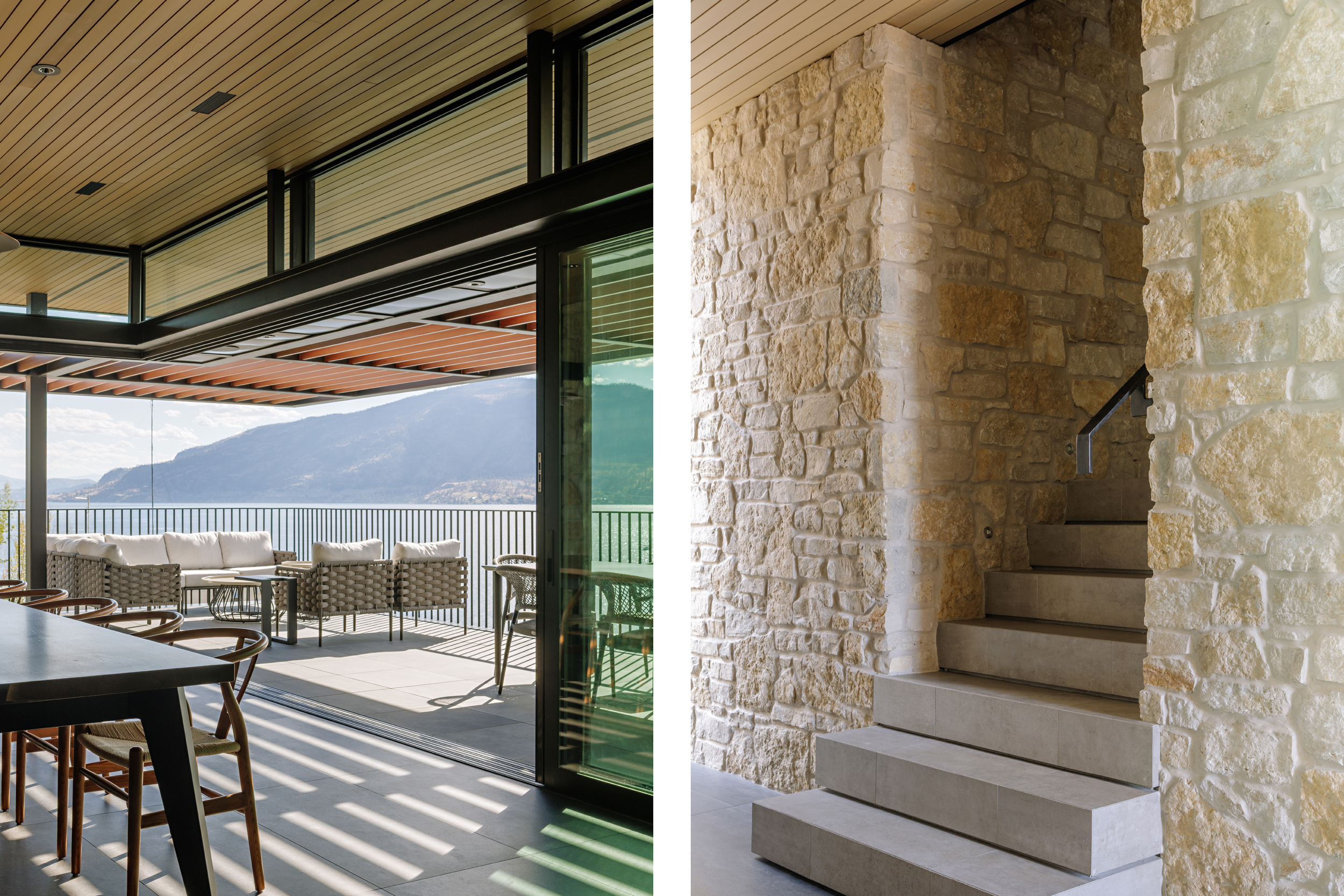 Interior view of a modern home showing a staircase with dark wood steps and a person walking up, and a bedroom with a freestanding bathtub near large windows overlooking a mountain lake.