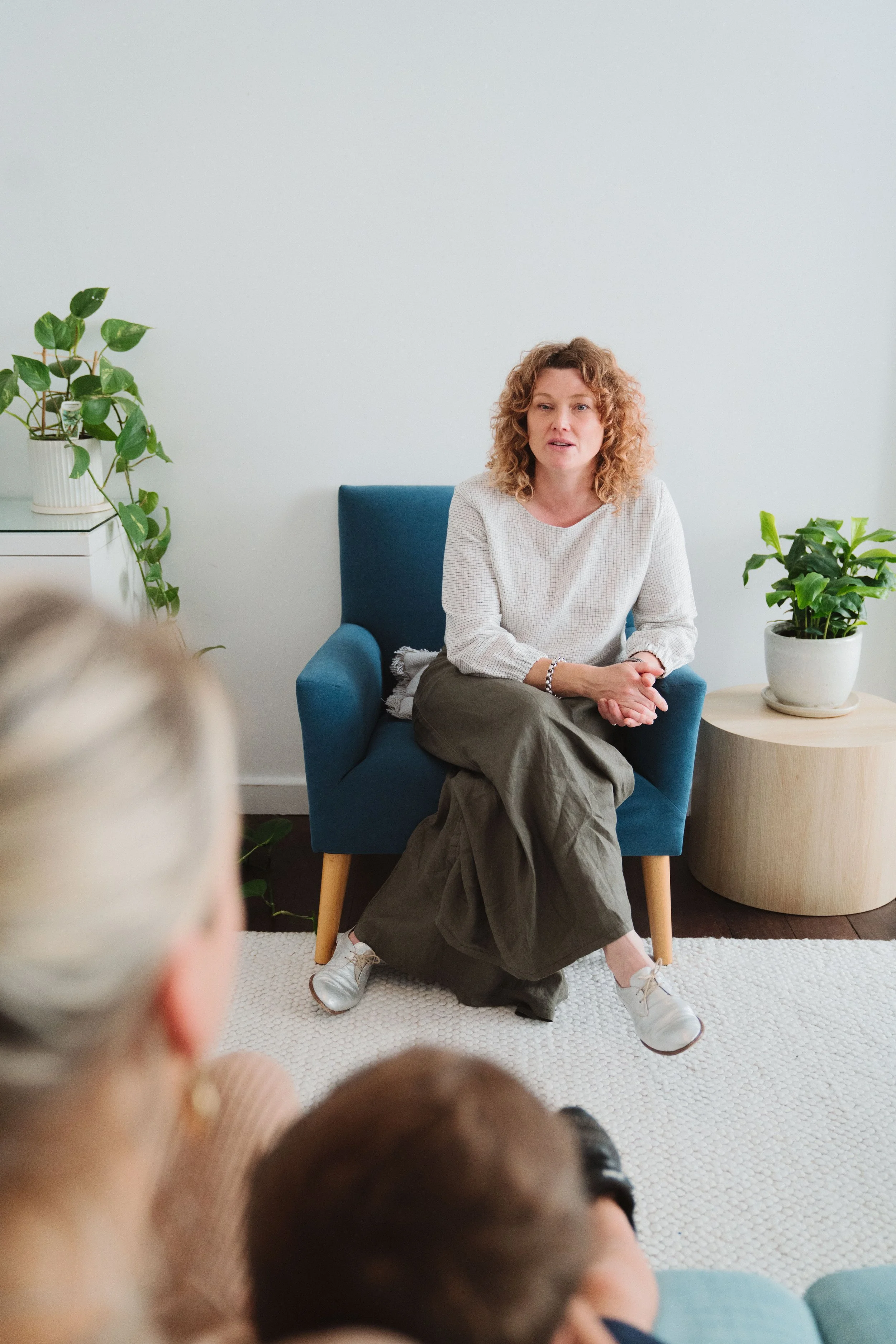 Counselor providing guidance for health distress, anxiety, and trauma in a safe space.