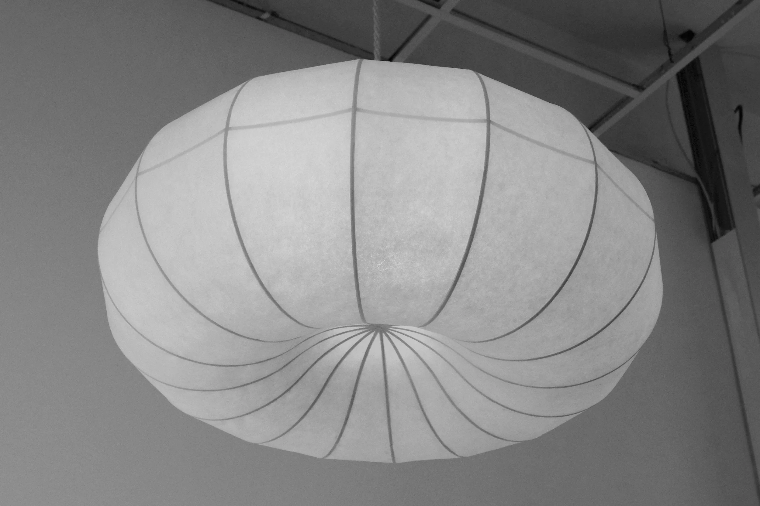 Plumus Pendant Light by Claud Christian, sculptural paper pendant with flowing convex and concave curves, ideal for contemporary interiors, statement lighting for designers.